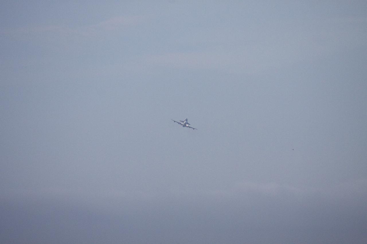 CAPE CANAVERAL, Fla. – At NASA's Kennedy Space Center in Florida, NASA's Shuttle Carrier Aircraft, or SCA, with the space shuttle Endeavour mounted atop, has just taken off for its ferry flight to California. Before heading west, the shuttle-SCA combination made several low-level passes over several locations on Florida's Space Coast.      The SCA, a modified 747 jetliner, will fly Endeavour to Los Angeles where it will be placed on public display at the California Science Center. This is the final ferry flight scheduled in the Space Shuttle Program era. For more information on the shuttles' transition and retirement, visit http://www.nasa.gov/transition.  Photo credit: NASA/Jim Grossmann