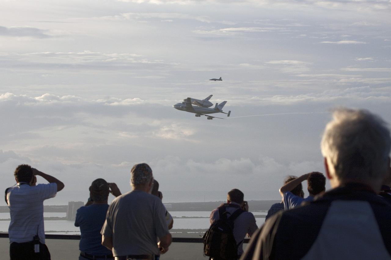 CAPE CANAVERAL, Fla. – At NASA's Kennedy Space Center in Florida, spectators get a close-up view as NASA's Shuttle Carrier Aircraft, or SCA, with the space shuttle Endeavour mounted atop, makes a low-level pass before heading west for its ferry flight to California.      The SCA, a modified 747 jetliner, will fly Endeavour to Los Angeles where it will be placed on public display at the California Science Center. This is the final ferry flight scheduled in the Space Shuttle Program era. For more information on the shuttles' transition and retirement, visit http://www.nasa.gov/transition.  Photo credit: NASA/Jim Grossmann