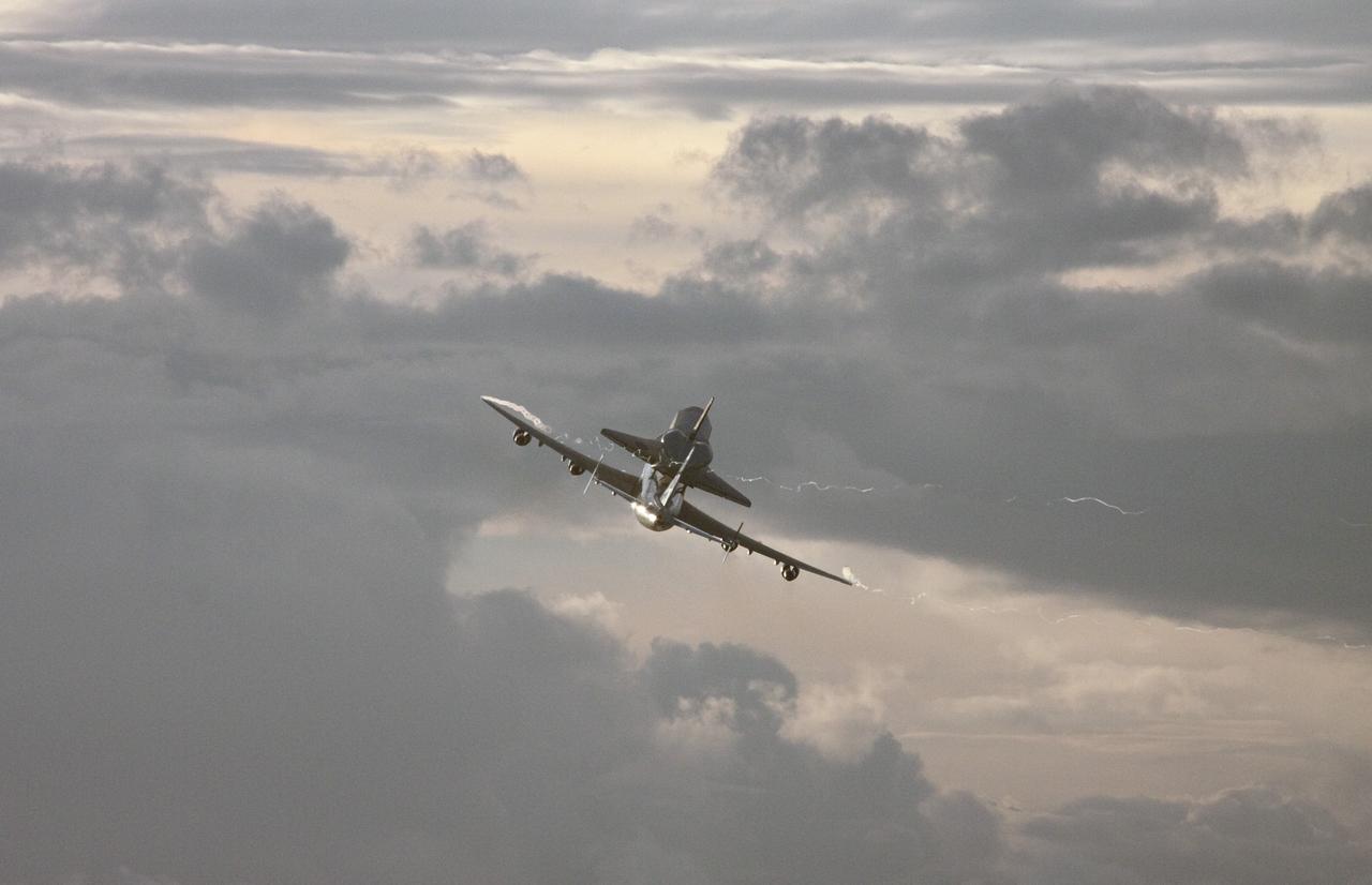 CAPE CANAVERAL, Fla. – At NASA's Kennedy Space Center in Florida, NASA's Shuttle Carrier Aircraft, or SCA, with the space shuttle Endeavour mounted atop, prepares to make a low-level pass over the Shuttle Landing Facility. The shuttle-SCA combination will then head west for its ferry flight to California. The SCA, a modified 747 jetliner, will fly Endeavour to Los Angeles where it will be placed on public display at the California Science Center. This is the final ferry flight scheduled in the Space Shuttle Program era. For more information on the shuttles' transition and retirement, visit http://www.nasa.gov/transition. Photo credit: NASA/Jim Grossmann