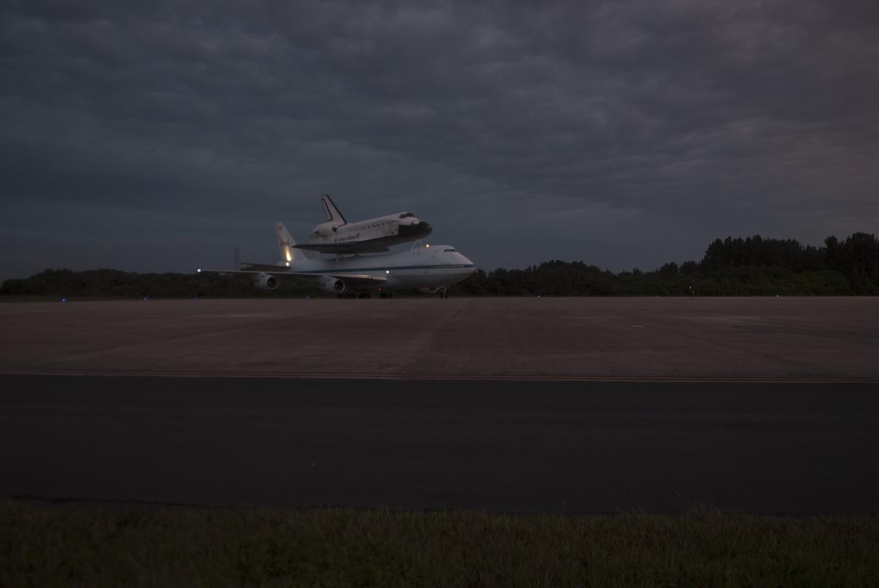 CAPE CANAVERAL, Fla. – At the Shuttle Landing Facility at NASA's Kennedy Space Center in Florida, NASA's Shuttle Carrier Aircraft, or SCA, with the space shuttle Endeavour mounted atop, taxis to the runway for its ferry flight to California. The SCA, a modified 747 jetliner, will fly Endeavour to Los Angeles where it will be placed on public display at the California Science Center. This is the final ferry flight scheduled in the Space Shuttle Program era. For more information on the shuttles' transition and retirement, visit http://www.nasa.gov/transition. Photo credit: NASA/George Sampson