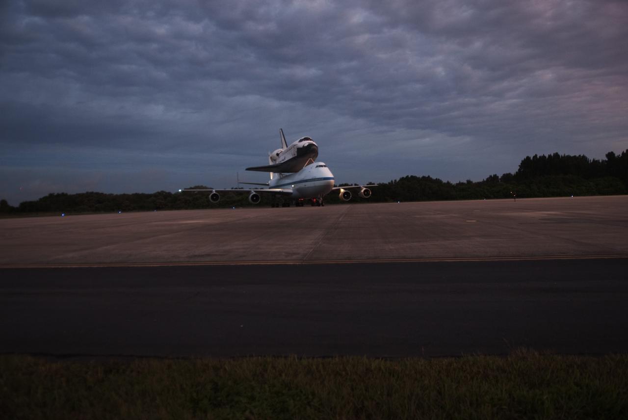 CAPE CANAVERAL, Fla. – At the Shuttle Landing Facility at NASA's Kennedy Space Center in Florida, NASA's Shuttle Carrier Aircraft, or SCA, with the space shuttle Endeavour mounted atop, taxis to the runway for its ferry flight to California. The SCA, a modified 747 jetliner, will fly Endeavour to Los Angeles where it will be placed on public display at the California Science Center. This is the final ferry flight scheduled in the Space Shuttle Program era. For more information on the shuttles' transition and retirement, visit http://www.nasa.gov/transition. Photo credit: NASA/George Sampson