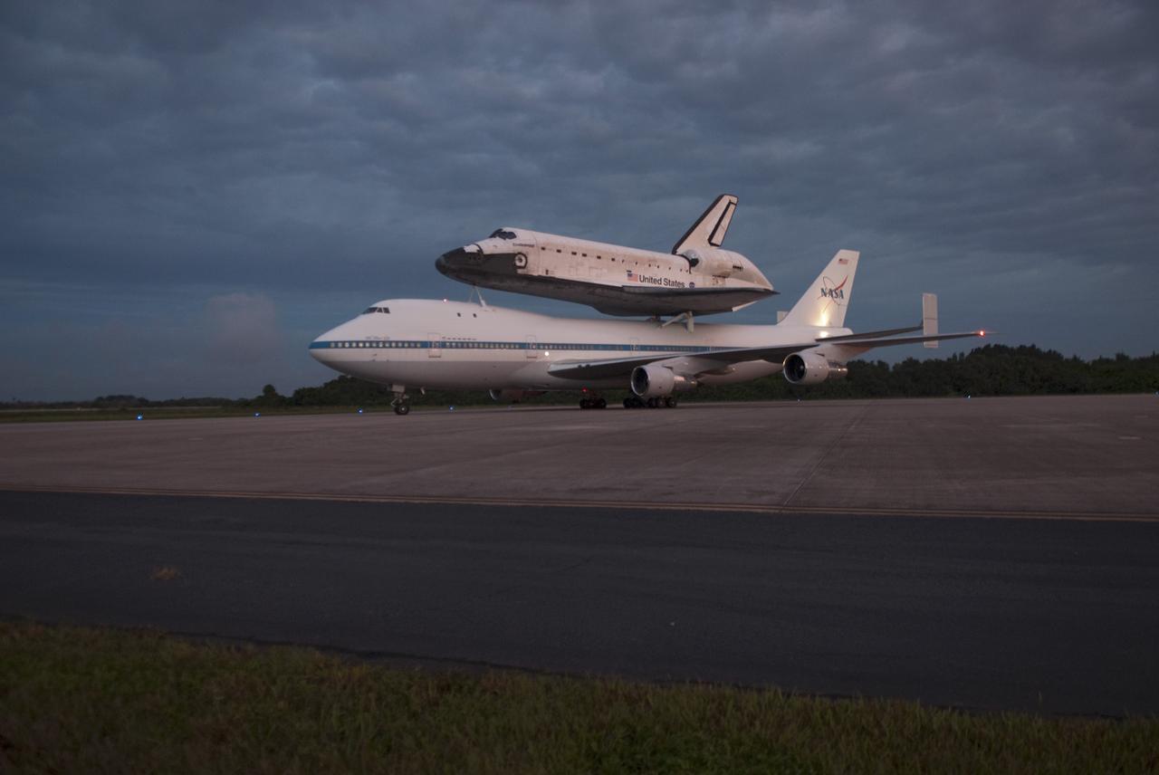 CAPE CANAVERAL, Fla. – At the Shuttle Landing Facility at NASA's Kennedy Space Center in Florida, NASA's Shuttle Carrier Aircraft, or SCA, with the space shuttle Endeavour mounted atop, taxis on the runway for its ferry flight to California. The SCA, a modified 747 jetliner, will fly Endeavour to Los Angeles where it will be placed on public display at the California Science Center. This is the final ferry flight scheduled in the Space Shuttle Program era. For more information on the shuttles' transition and retirement, visit http://www.nasa.gov/transition. Photo credit: NASA/George Sampson