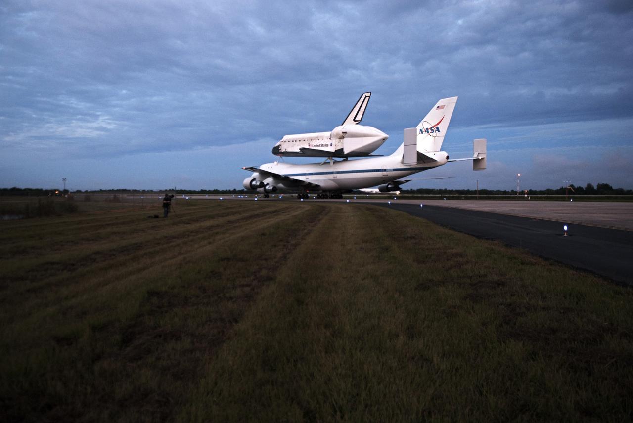 CAPE CANAVERAL, Fla. – At the Shuttle Landing Facility at NASA's Kennedy Space Center in Florida, NASA's Shuttle Carrier Aircraft, or SCA, with the space shuttle Endeavour mounted atop, taxis on the runway for its ferry flight to California. The SCA, a modified 747 jetliner, will fly Endeavour to Los Angeles where it will be placed on public display at the California Science Center. This is the final ferry flight scheduled in the Space Shuttle Program era. For more information on the shuttles' transition and retirement, visit http://www.nasa.gov/transition. Photo credit: NASA/George Sampson