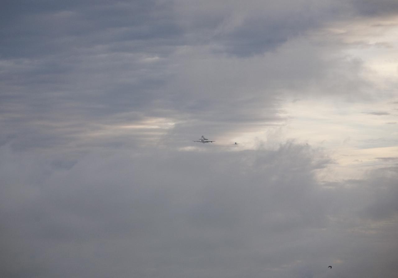 COCOA BEACH, Fla. – NASA's Shuttle Carrier Aircraft, or SCA, with the space shuttle Endeavour mounted atop is accompanied by its pathfinder aircraft flying along Cocoa Beach. The SCA, a modified 747 jetliner, will fly Endeavour to Los Angeles where it will be placed on public display at the California Science Center. This is the final ferry flight scheduled in the Space Shuttle Program era. For more information on the shuttles' transition and retirement, visit http://www.nasa.gov/transition. Photo credit: NASA/Alan Ault
