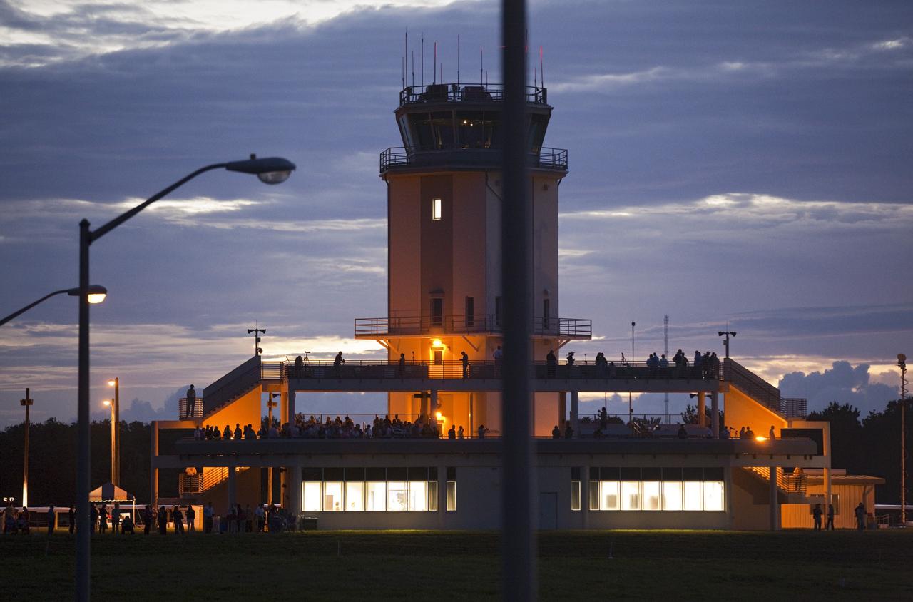CAPE CANAVERAL, Fla. – As the sun rises, the control tower is illuminated at the Shuttle Landing Facility at NASA's Kennedy Space Center in Florida. Preparations are underway for NASA's Shuttle Carrier Aircraft, or SCA, with the space shuttle Endeavour mounted atop, to begin its ferry flight to California. The SCA, a modified 747 jetliner, will fly Endeavour to Los Angeles where it will be placed on public display at the California Science Center. This is the final ferry flight scheduled in the Space Shuttle Program era. For more information on the shuttles' transition and retirement, visit http://www.nasa.gov/transition. Photo credit: NASA/Frankie Martin