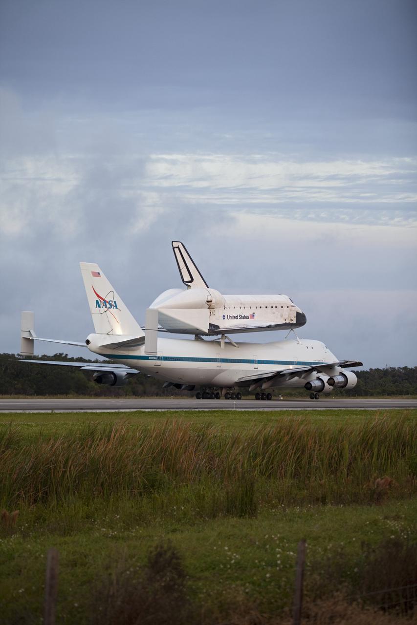 CAPE CANAVERAL, Fla. – At the Shuttle Landing Facility at NASA's Kennedy Space Center in Florida, NASA's Shuttle Carrier Aircraft, or SCA, with the space shuttle Endeavour mounted atop, taxis on the runway for its ferry flight to California. The SCA, a modified 747 jetliner, will fly Endeavour to Los Angeles where it will be placed on public display at the California Science Center. This is the final ferry flight scheduled in the Space Shuttle Program era. For more information on the shuttles' transition and retirement, visit http://www.nasa.gov/transition. Photo credit: NASA/Frankie Martin