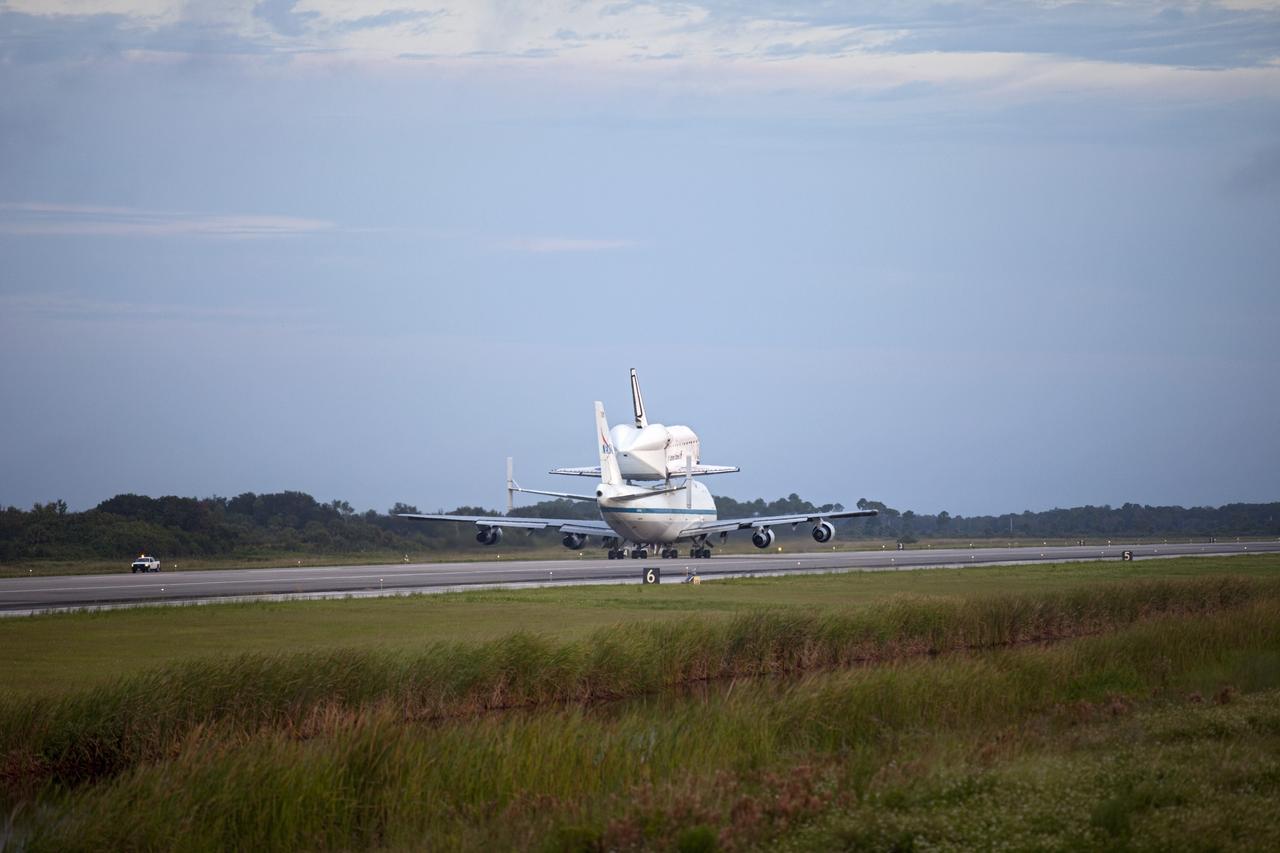 CAPE CANAVERAL, Fla. – At the Shuttle Landing Facility at NASA's Kennedy Space Center in Florida, NASA's Shuttle Carrier Aircraft, or SCA, with the space shuttle Endeavour mounted atop, taxis on the runway for its ferry flight to California. The SCA, a modified 747 jetliner, will fly Endeavour to Los Angeles where it will be placed on public display at the California Science Center. This is the final ferry flight scheduled in the Space Shuttle Program era. For more information on the shuttles' transition and retirement, visit http://www.nasa.gov/transition. Photo credit: NASA/Frankie Martin