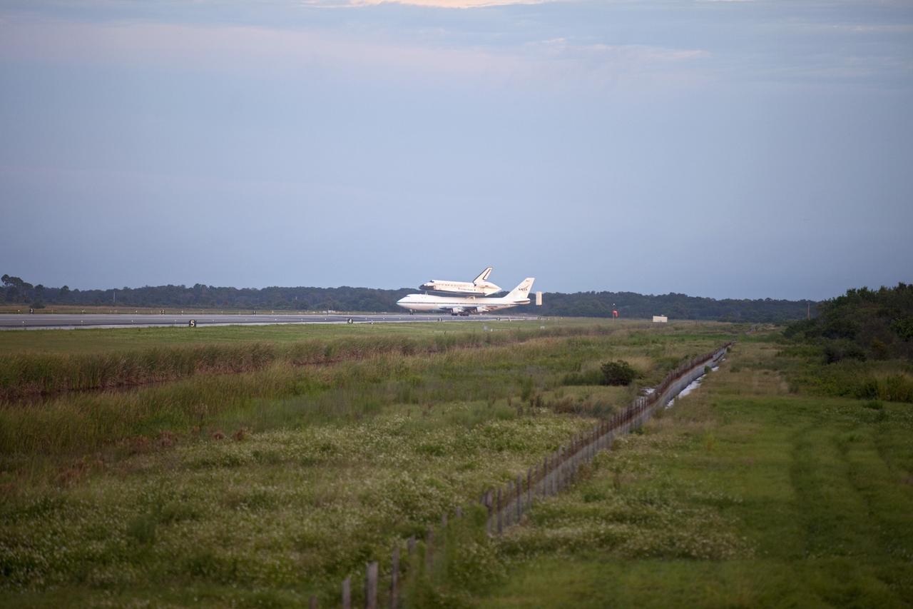 CAPE CANAVERAL, Fla. – At the Shuttle Landing Facility at NASA's Kennedy Space Center in Florida, NASA's Shuttle Carrier Aircraft, or SCA, with the space shuttle Endeavour mounted atop, taxis on the runway for its ferry flight to California. The SCA, a modified 747 jetliner, will fly Endeavour to Los Angeles where it will be placed on public display at the California Science Center. This is the final ferry flight scheduled in the Space Shuttle Program era. For more information on the shuttles' transition and retirement, visit http://www.nasa.gov/transition. Photo credit: NASA/Frankie Martin