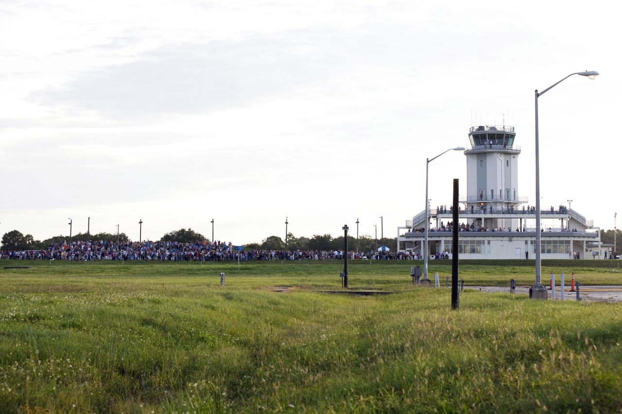 CAPE CANAVERAL, Fla. – A large crowd of news media and spectators were on hand near the control tower viewing area at the Shuttle Landing Facility at NASA's Kennedy Space Center in Florida to watch NASA's Shuttle Carrier Aircraft, or SCA, with the space shuttle Endeavour mounted atop, begin its ferry flight to California.    The SCA, a modified 747 jetliner, will fly Endeavour to Los Angeles where it will be placed on public display at the California Science Center. This is the final ferry flight scheduled in the Space Shuttle Program era. For more information on the shuttles' transition and retirement, visit http://www.nasa.gov/transition.  Photo credit: NASA/Frankie Martin