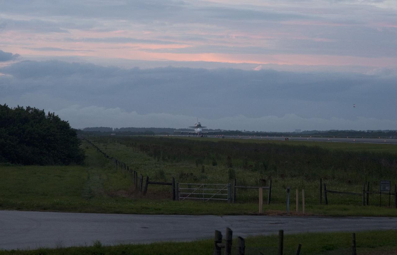 CAPE CANAVERAL, Fla. – Space shuttle Endeavour, mounted atop NASA's Shuttle Carrier Aircraft or SCA, taxis down the runway at the Shuttle Landing Facility at NASA's Kennedy Space Center in Florida. The SCA, a modified 747 jetliner, will fly Endeavour to Los Angeles where it will be placed on public display at the California Science Center. This is the final ferry flight scheduled in the Space Shuttle Program era. For more information on the shuttles' transition and retirement, visit http://www.nasa.gov/transition. Photo credit: NASA/Rusty Backer  The SCA, a modified 747 jetliner, will fly Endeavour to Los Angeles where it will be placed on public display at the California Science Center. This is the final ferry flight scheduled in the Space Shuttle Program era. For more information on the shuttles' transition and retirement, visit http://www.nasa.gov/transition.  Photo credit: NASA/Jim Grossmann