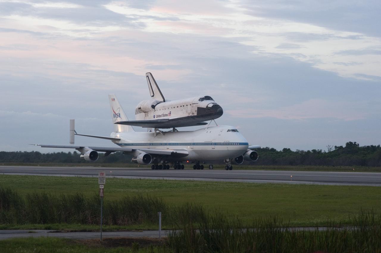 CAPE CANAVERAL, Fla. – Space shuttle Endeavour, mounted atop NASA's Shuttle Carrier Aircraft or SCA, taxis down the runway at the Shuttle Landing Facility at NASA's Kennedy Space Center in Florida. The SCA, a modified 747 jetliner, will fly Endeavour to Los Angeles where it will be placed on public display at the California Science Center. This is the final ferry flight scheduled in the Space Shuttle Program era. For more information on the shuttles' transition and retirement, visit http://www.nasa.gov/transition. Photo credit: NASA/Rusty Backer