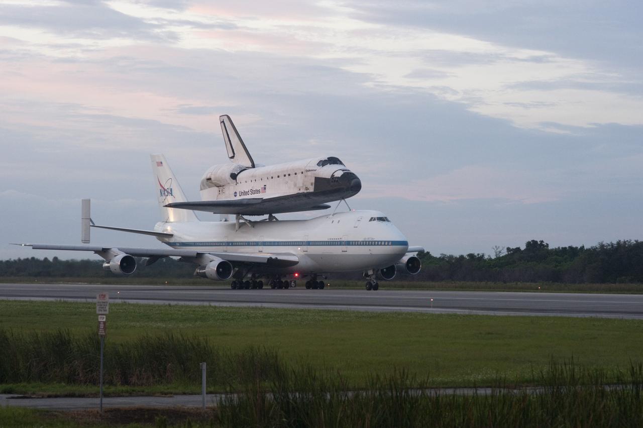 CAPE CANAVERAL, Fla. – Space shuttle Endeavour, mounted atop NASA's Shuttle Carrier Aircraft or SCA, taxis down the runway at the Shuttle Landing Facility at NASA's Kennedy Space Center in Florida. The SCA, a modified 747 jetliner, will fly Endeavour to Los Angeles where it will be placed on public display at the California Science Center. This is the final ferry flight scheduled in the Space Shuttle Program era. For more information on the shuttles' transition and retirement, visit http://www.nasa.gov/transition. Photo credit: NASA/Rusty Backer