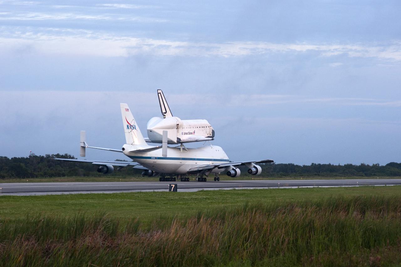 CAPE CANAVERAL, Fla. – Space shuttle Endeavour, mounted atop NASA's Shuttle Carrier Aircraft or SCA, taxis down the runway at the Shuttle Landing Facility at NASA's Kennedy Space Center in Florida. The SCA, a modified 747 jetliner, will fly Endeavour to Los Angeles where it will be placed on public display at the California Science Center. This is the final ferry flight scheduled in the Space Shuttle Program era. For more information on the shuttles' transition and retirement, visit http://www.nasa.gov/transition. Photo credit: NASA/Rusty Backer