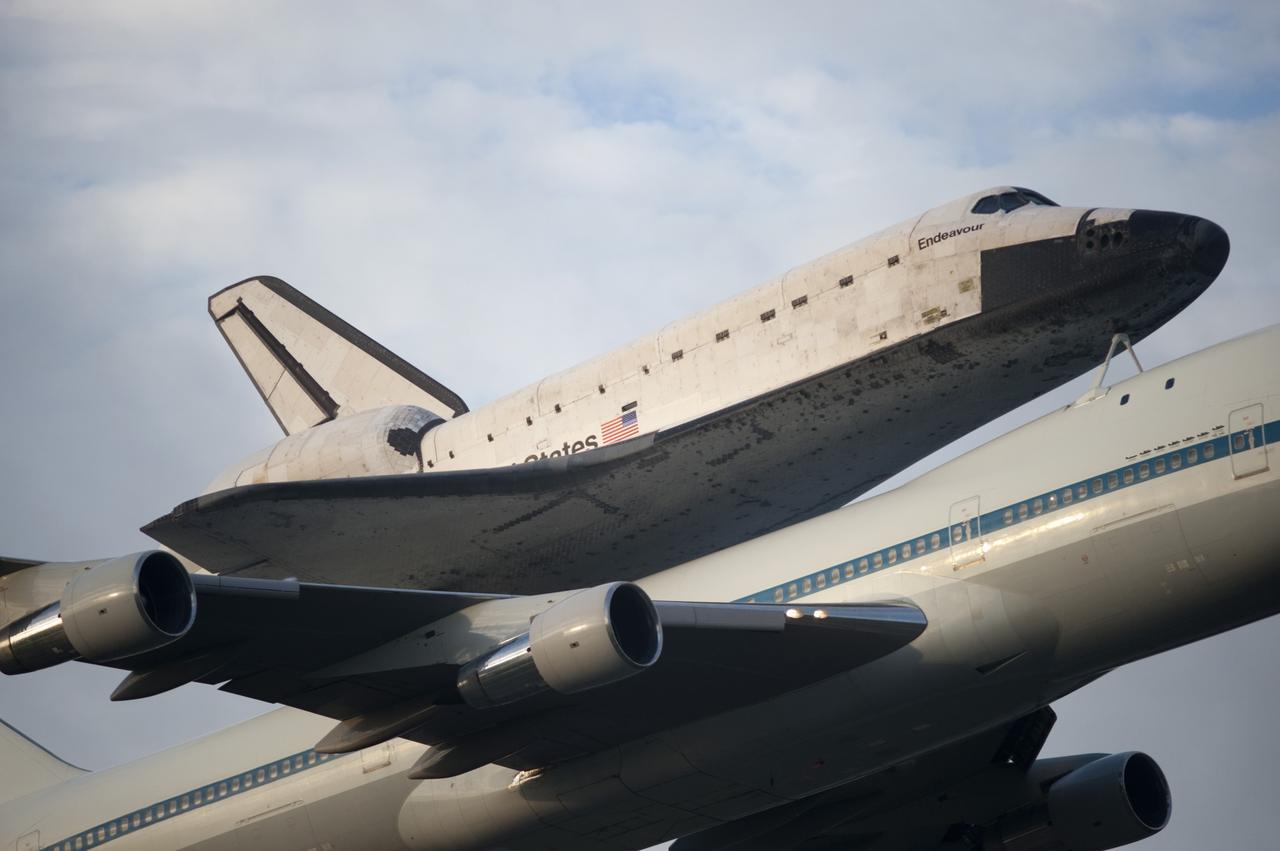 CAPE CANAVERAL, Fla. – Space shuttle Endeavour, mounted atop NASA's Shuttle Carrier Aircraft or SCA, takes off from the Shuttle Landing Facility at NASA's Kennedy Space Center in Florida. The SCA, a modified 747 jetliner, will fly Endeavour to Los Angeles where it will be placed on public display at the California Science Center. This is the final ferry flight scheduled in the Space Shuttle Program era. For more information on the shuttles' transition and retirement, visit http://www.nasa.gov/transition. Photo credit: NASA/Rusty Backer