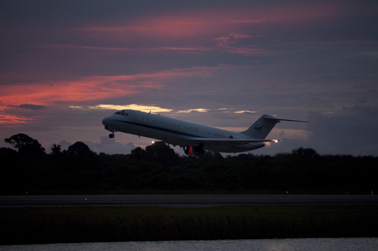 CAPE CANAVERAL, Fla. – NASA's C-9 aircraft takes off ahead of the space shuttle Endeavour, mounted atop NASA's Shuttle Carrier Aircraft or SCA at the Shuttle Landing Facility at NASA's Kennedy Space Center in Florida. The SCA, a modified 747 jetliner, will fly Endeavour to Los Angeles where it will be placed on public display at the California Science Center. This is the final ferry flight scheduled in the Space Shuttle Program era. For more information on the shuttles' transition and retirement, visit http://www.nasa.gov/transition. Photo credit: NASA/Rick Wetherington