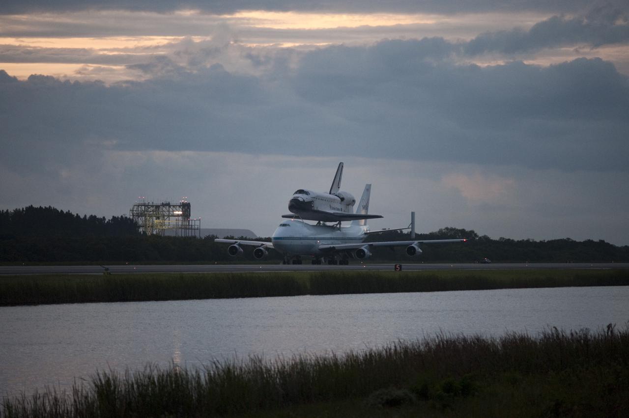 CAPE CANAVERAL, Fla. – Space shuttle Endeavour, mounted atop NASA's Shuttle Carrier Aircraft or SCA, taxis at the Shuttle Landing Facility at NASA's Kennedy Space Center in Florida. The SCA, a modified 747 jetliner, will fly Endeavour to Los Angeles where it will be placed on public display at the California Science Center. This is the final ferry flight scheduled in the Space Shuttle Program era. For more information on the shuttles' transition and retirement, visit http://www.nasa.gov/transition. Photo credit: NASA/Rick Wetherington