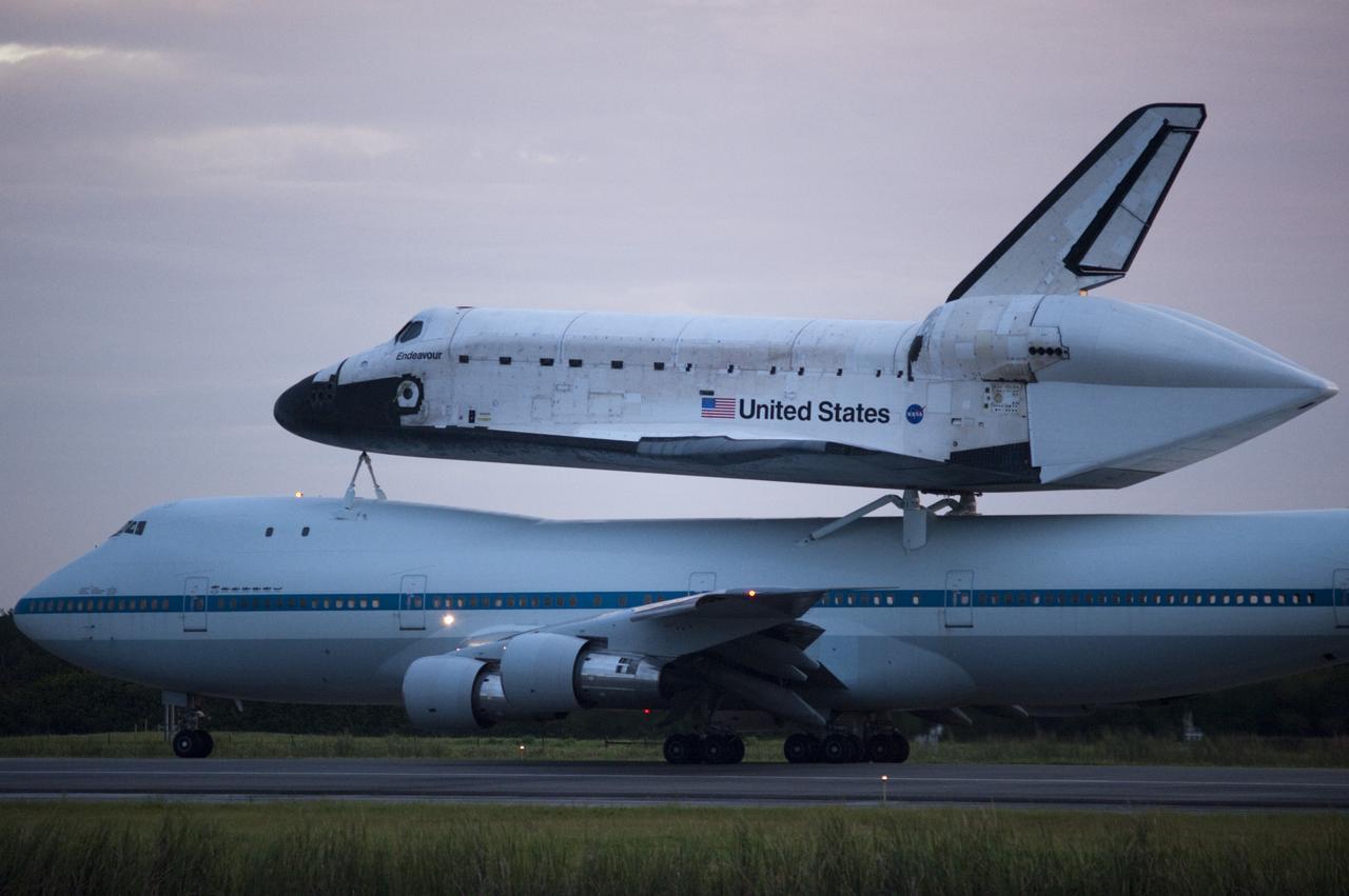 CAPE CANAVERAL, Fla. – Space shuttle Endeavour, mounted atop NASA's Shuttle Carrier Aircraft or SCA, taxis at the Shuttle Landing Facility at NASA's Kennedy Space Center in Florida. The SCA, a modified 747 jetliner, will fly Endeavour to Los Angeles where it will be placed on public display at the California Science Center. This is the final ferry flight scheduled in the Space Shuttle Program era. For more information on the shuttles' transition and retirement, visit http://www.nasa.gov/transition. Photo credit: NASA/Rick Wetherington