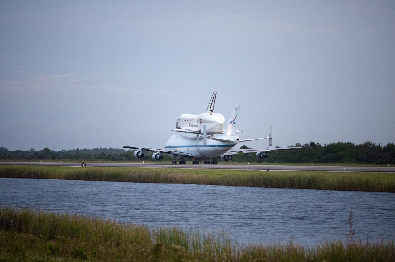CAPE CANAVERAL, Fla. – Space shuttle Endeavour, mounted atop NASA's Shuttle Carrier Aircraft or SCA, taxis at the Shuttle Landing Facility at NASA's Kennedy Space Center in Florida. The SCA, a modified 747 jetliner, will fly Endeavour to Los Angeles where it will be placed on public display at the California Science Center. This is the final ferry flight scheduled in the Space Shuttle Program era. For more information on the shuttles' transition and retirement, visit http://www.nasa.gov/transition. Photo credit: NASA/Rick Wetherington