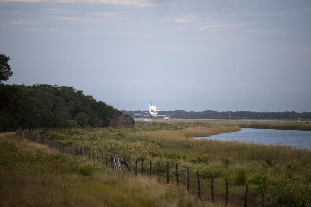 CAPE CANAVERAL, Fla. – Space shuttle Endeavour, mounted atop NASA's Shuttle Carrier Aircraft or SCA, taxis at the Shuttle Landing Facility at NASA's Kennedy Space Center in Florida. The SCA, a modified 747 jetliner, will fly Endeavour to Los Angeles where it will be placed on public display at the California Science Center. This is the final ferry flight scheduled in the Space Shuttle Program era. For more information on the shuttles' transition and retirement, visit http://www.nasa.gov/transition. Photo credit: NASA/Rick Wetherington