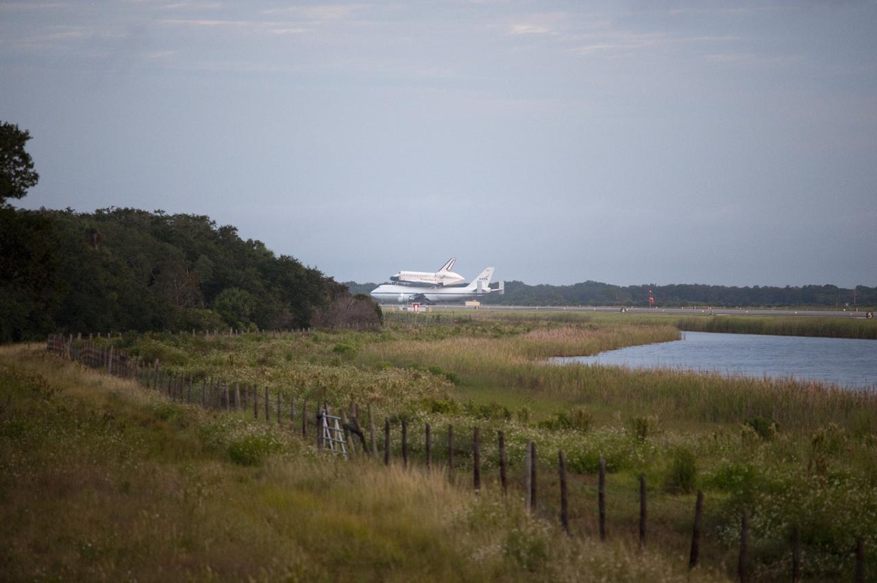 CAPE CANAVERAL, Fla. – Space shuttle Endeavour, mounted atop NASA's Shuttle Carrier Aircraft or SCA, taxis at the Shuttle Landing Facility at NASA's Kennedy Space Center in Florida. The SCA, a modified 747 jetliner, will fly Endeavour to Los Angeles where it will be placed on public display at the California Science Center. This is the final ferry flight scheduled in the Space Shuttle Program era. For more information on the shuttles' transition and retirement, visit http://www.nasa.gov/transition. Photo credit: NASA/Rick Wetherington