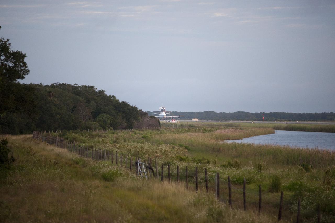 CAPE CANAVERAL, Fla. – Space shuttle Endeavour, mounted atop NASA's Shuttle Carrier Aircraft or SCA, taxis at the Shuttle Landing Facility at NASA's Kennedy Space Center in Florida. The SCA, a modified 747 jetliner, will fly Endeavour to Los Angeles where it will be placed on public display at the California Science Center. This is the final ferry flight scheduled in the Space Shuttle Program era. For more information on the shuttles' transition and retirement, visit http://www.nasa.gov/transition. Photo credit: NASA/Rick Wetherington