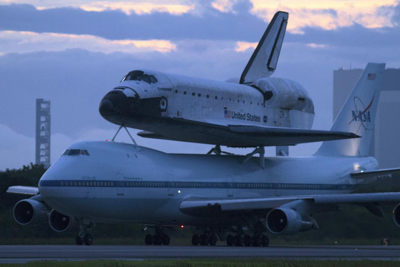 CAPE CANAVERAL, Fla. – Space shuttle Endeavour, mounted atop NASA's Shuttle Carrier Aircraft or SCA, taxis at the Shuttle Landing Facility at NASA's Kennedy Space Center in Florida. The SCA, a modified 747 jetliner, will fly Endeavour to Los Angeles where it will be placed on public display at the California Science Center. This is the final ferry flight scheduled in the Space Shuttle Program era. For more information on the shuttles' transition and retirement, visit http://www.nasa.gov/transition. Photo credit: NASA/Rick Wetherington