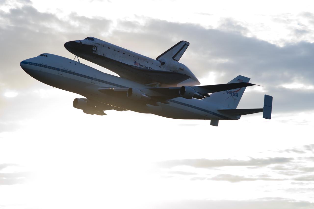 CAPE CANAVERAL, Fla. – Space shuttle Endeavour, mounted atop NASA's Shuttle Carrier Aircraft or SCA, takes off from the Shuttle Landing Facility at NASA's Kennedy Space Center in Florida. The SCA, a modified 747 jetliner, will fly Endeavour to Los Angeles where it will be placed on public display at the California Science Center. This is the final ferry flight scheduled in the Space Shuttle Program era. For more information on the shuttles' transition and retirement, visit http://www.nasa.gov/transition. Photo credit: NASA/Rick Wetherington