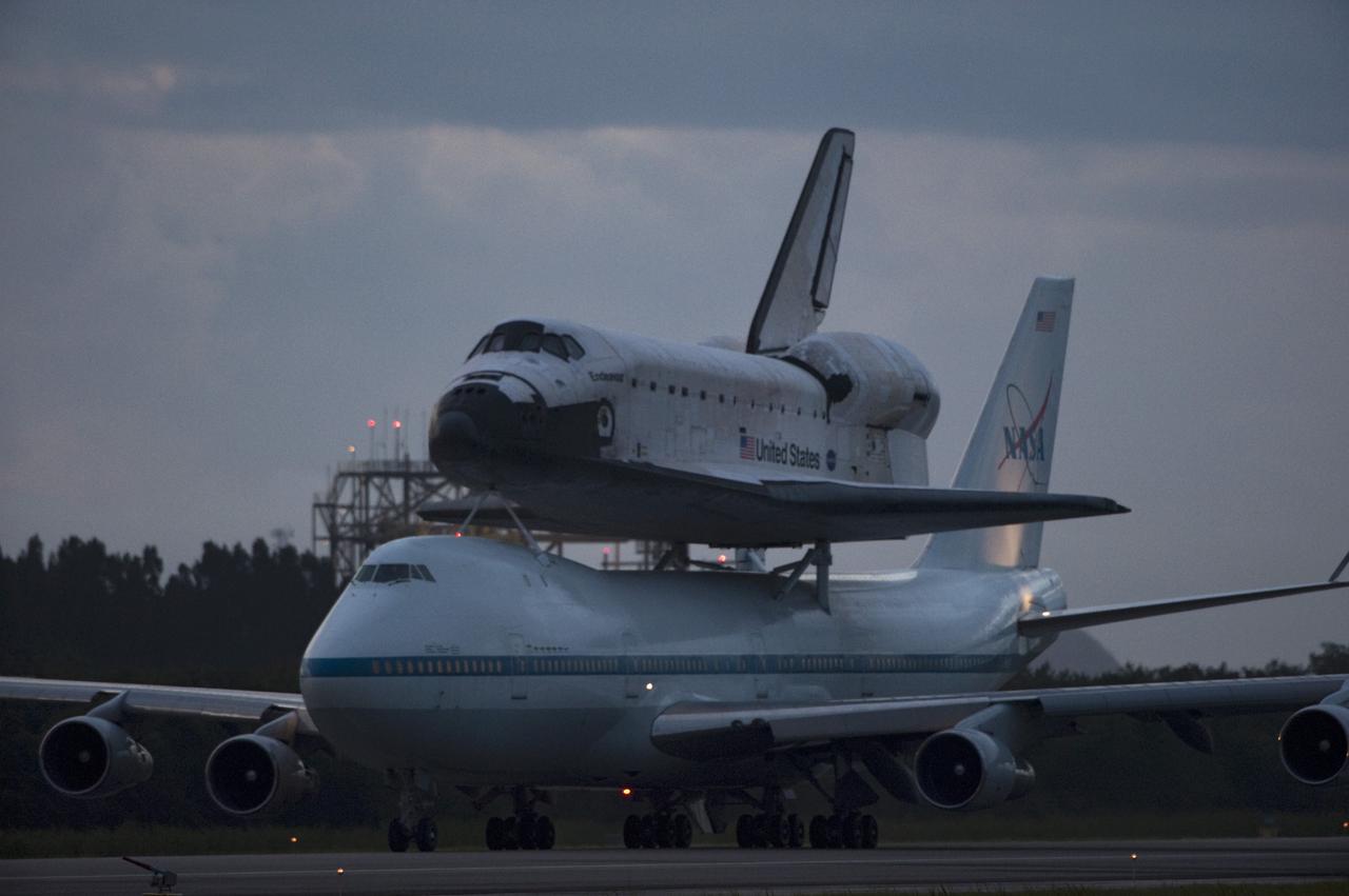 CAPE CANAVERAL, Fla. – Space shuttle Endeavour, mounted atop NASA's Shuttle Carrier Aircraft or SCA, taxis at the Shuttle Landing Facility at NASA's Kennedy Space Center in Florida. The SCA, a modified 747 jetliner, will fly Endeavour to Los Angeles where it will be placed on public display at the California Science Center. This is the final ferry flight scheduled in the Space Shuttle Program era. For more information on the shuttles' transition and retirement, visit http://www.nasa.gov/transition. Photo credit: NASA/Rick Wetherington