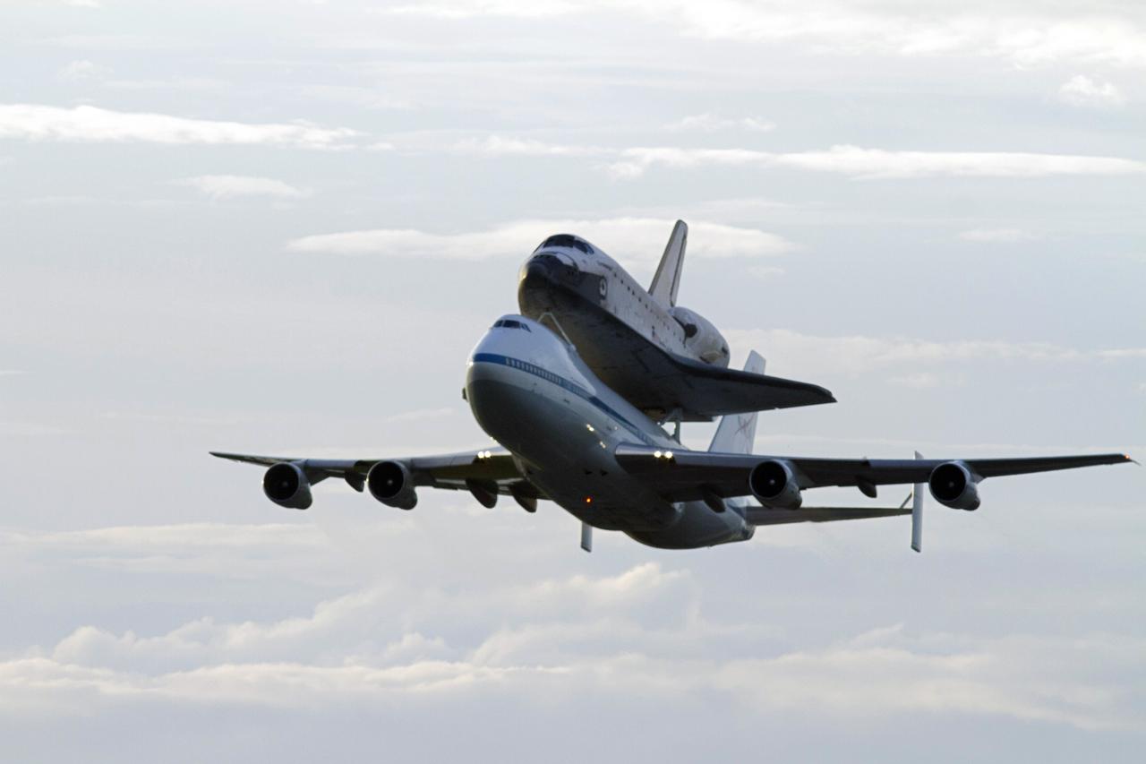 CAPE CANAVERAL, Fla. – Space shuttle Endeavour, mounted atop NASA's Shuttle Carrier Aircraft or SCA, flies over the Shuttle Landing Facility at NASA's Kennedy Space Center in Florida. The SCA, a modified 747 jetliner, will fly Endeavour to Los Angeles where it will be placed on public display at the California Science Center. This is the final ferry flight scheduled in the Space Shuttle Program era. For more information on the shuttles' transition and retirement, visit http://www.nasa.gov/transition. Photo credit: NASA/Rick Wetherington