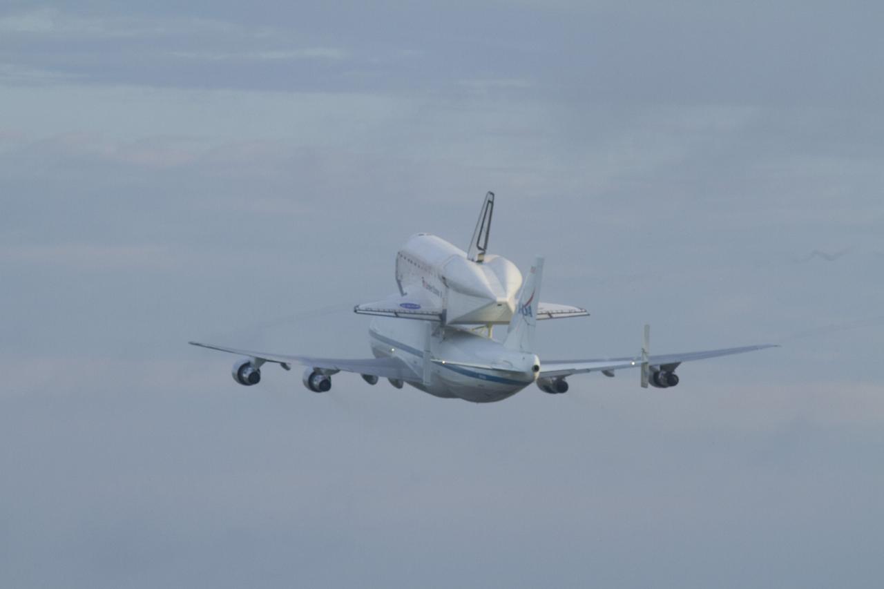 CAPE CANAVERAL, Fla. – Space shuttle Endeavour, mounted atop NASA's Shuttle Carrier Aircraft or SCA, flies over the Shuttle Landing Facility at NASA's Kennedy Space Center in Florida. The SCA, a modified 747 jetliner, will fly Endeavour to Los Angeles where it will be placed on public display at the California Science Center. This is the final ferry flight scheduled in the Space Shuttle Program era. For more information on the shuttles' transition and retirement, visit http://www.nasa.gov/transition. Photo credit: NASA/Rick Wetherington