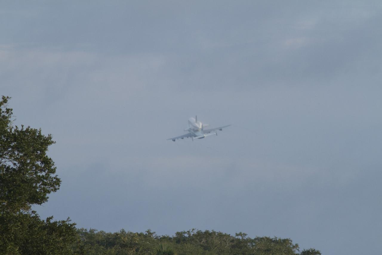 CAPE CANAVERAL, Fla. – Space shuttle Endeavour, mounted atop NASA's Shuttle Carrier Aircraft or SCA, flies over the Shuttle Landing Facility at NASA's Kennedy Space Center in Florida. The SCA, a modified 747 jetliner, will fly Endeavour to Los Angeles where it will be placed on public display at the California Science Center. This is the final ferry flight scheduled in the Space Shuttle Program era. For more information on the shuttles' transition and retirement, visit http://www.nasa.gov/transition. Photo credit: NASA/Rick Wetherington