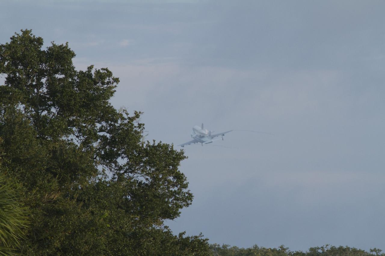 CAPE CANAVERAL, Fla. – Space shuttle Endeavour, mounted atop NASA's Shuttle Carrier Aircraft or SCA, flies over the Shuttle Landing Facility at NASA's Kennedy Space Center in Florida. The SCA, a modified 747 jetliner, will fly Endeavour to Los Angeles where it will be placed on public display at the California Science Center. This is the final ferry flight scheduled in the Space Shuttle Program era. For more information on the shuttles' transition and retirement, visit http://www.nasa.gov/transition. Photo credit: NASA/Rick Wetherington