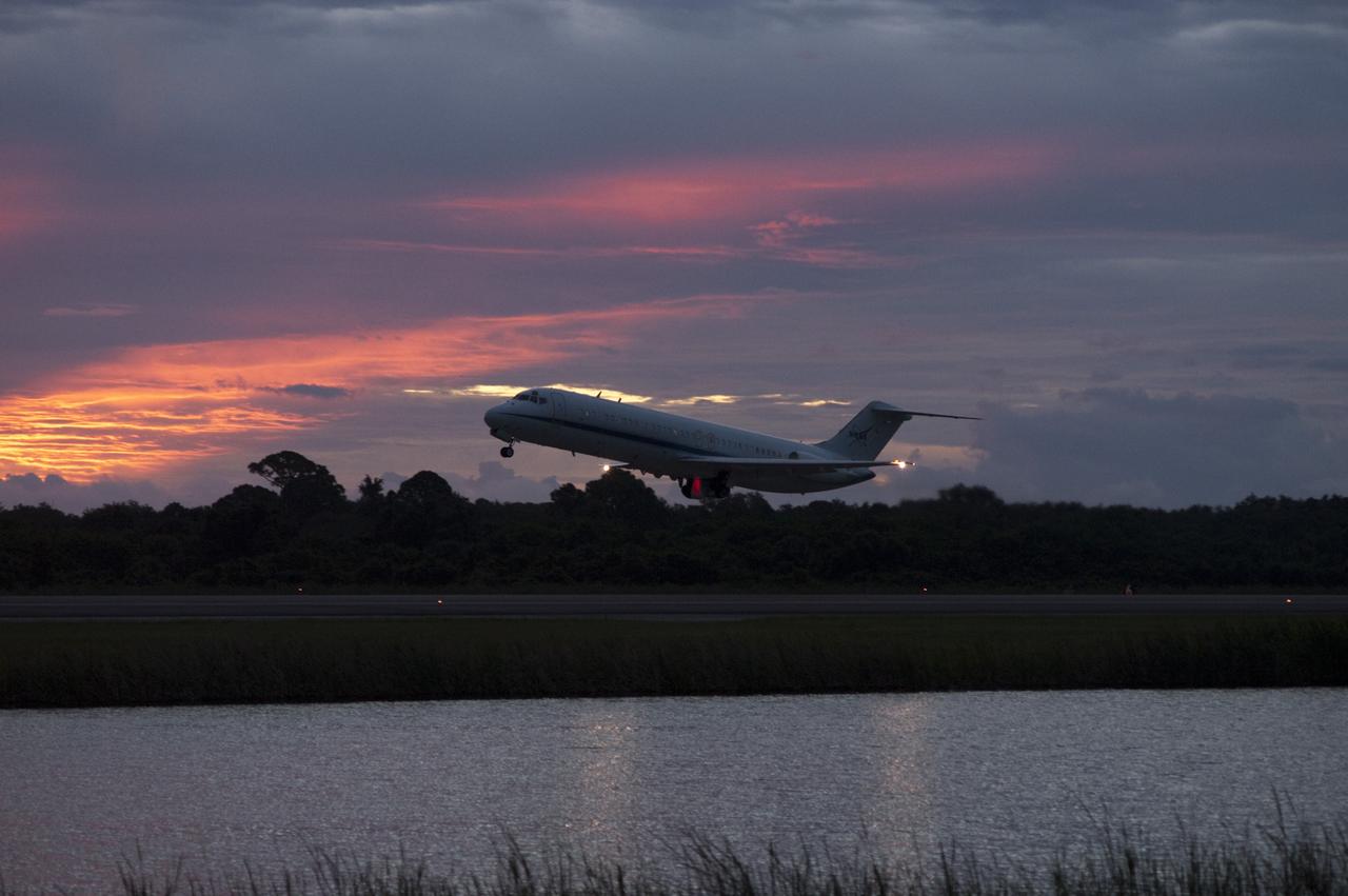 CAPE CANAVERAL, Fla. – NASA's C-9 aircraft takes off ahead of the space shuttle Endeavour, mounted atop NASA's Shuttle Carrier Aircraft or SCA at Shuttle Landing Facility at NASA's Kennedy Space Center in Florida. The SCA, a modified 747 jetliner, will fly Endeavour to Los Angeles where it will be placed on public display at the California Science Center. This is the final ferry flight scheduled in the Space Shuttle Program era. For more information on the shuttles' transition and retirement, visit http://www.nasa.gov/transition. Photo credit: NASA/Rick Wetherington