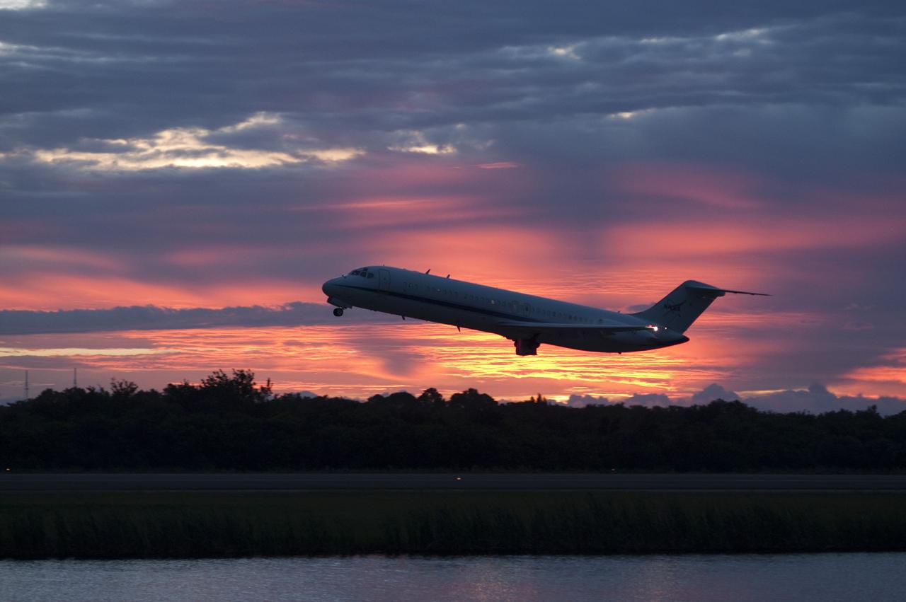 CAPE CANAVERAL, Fla. – NASA's C-9 aircraft takes off ahead of the space shuttle Endeavour, mounted atop NASA's Shuttle Carrier Aircraft or SCA at Shuttle Landing Facility at NASA's Kennedy Space Center in Florida. The SCA, a modified 747 jetliner, will fly Endeavour to Los Angeles where it will be placed on public display at the California Science Center. This is the final ferry flight scheduled in the Space Shuttle Program era. For more information on the shuttles' transition and retirement, visit http://www.nasa.gov/transition. Photo credit: NASA/Rick Wetherington