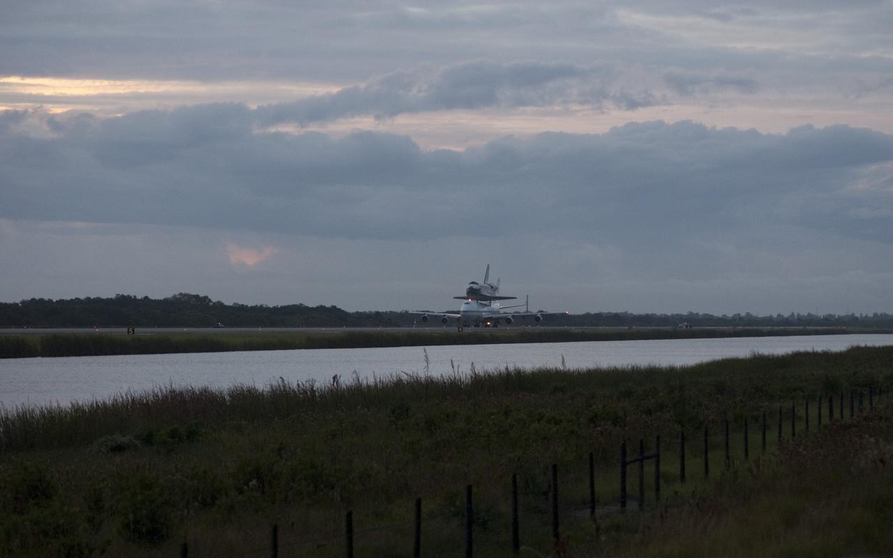 CAPE CANAVERAL, Fla. – Space shuttle Endeavour, mounted atop NASA's Shuttle Carrier Aircraft or SCA, taxis at the Shuttle Landing Facility at NASA's Kennedy Space Center in Florida. The SCA, a modified 747 jetliner, will fly Endeavour to Los Angeles where it will be placed on public display at the California Science Center. This is the final ferry flight scheduled in the Space Shuttle Program era. For more information on the shuttles' transition and retirement, visit http://www.nasa.gov/transition. Photo credit: NASA/Rick Wetherington