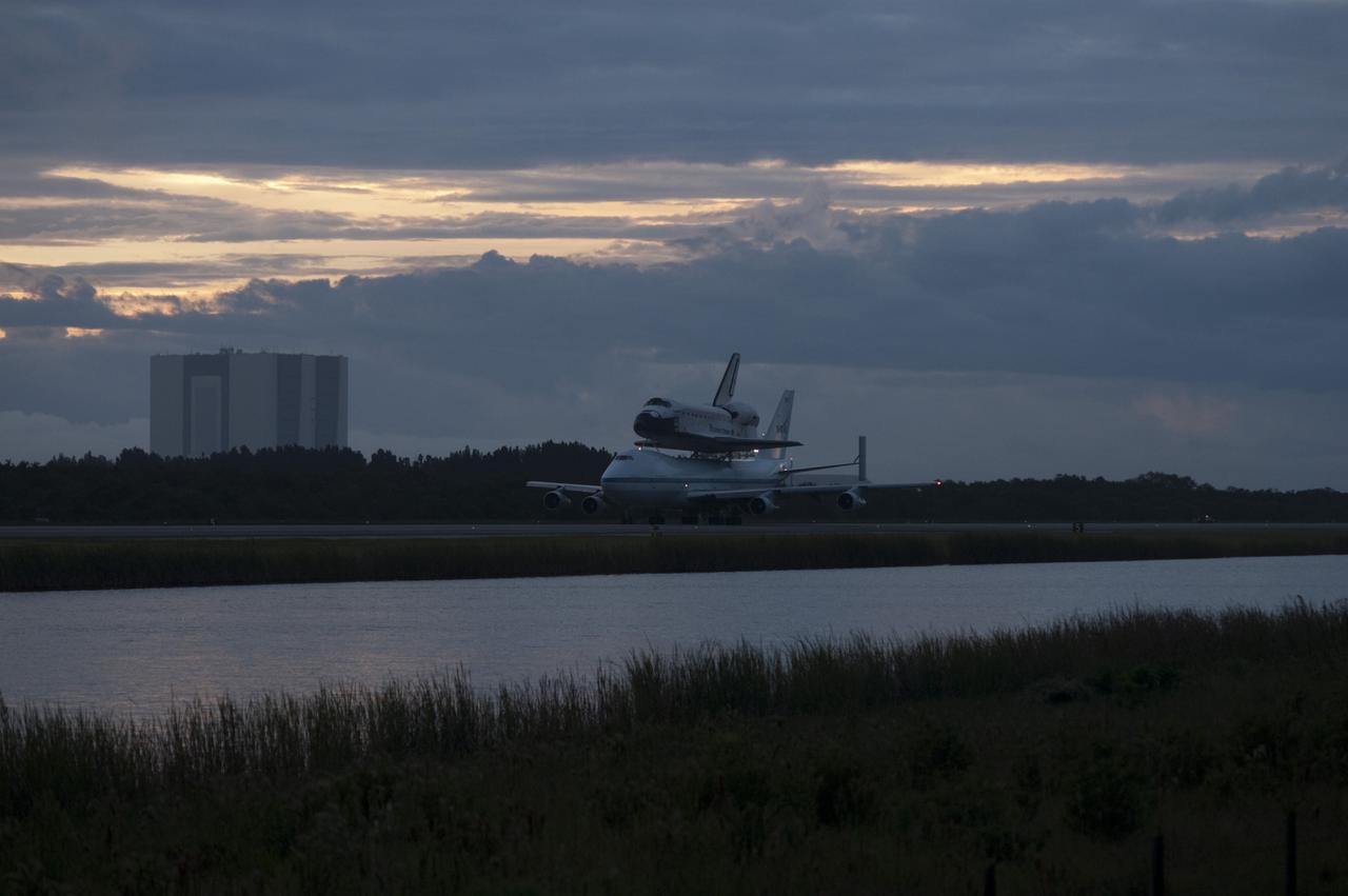 CAPE CANAVERAL, Fla. – Space shuttle Endeavour, mounted atop NASA's Shuttle Carrier Aircraft or SCA, taxis at the Shuttle Landing Facility at NASA's Kennedy Space Center in Florida. The SCA, a modified 747 jetliner, will fly Endeavour to Los Angeles where it will be placed on public display at the California Science Center. This is the final ferry flight scheduled in the Space Shuttle Program era. For more information on the shuttles' transition and retirement, visit http://www.nasa.gov/transition. Photo credit: NASA/Rick Wetherington