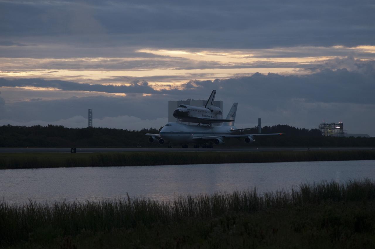 CAPE CANAVERAL, Fla. – Space shuttle Endeavour, mounted atop NASA's Shuttle Carrier Aircraft or SCA, taxis at the Shuttle Landing Facility at NASA's Kennedy Space Center in Florida. The SCA, a modified 747 jetliner, will fly Endeavour to Los Angeles where it will be placed on public display at the California Science Center. This is the final ferry flight scheduled in the Space Shuttle Program era. For more information on the shuttles' transition and retirement, visit http://www.nasa.gov/transition. Photo credit: NASA/Rick Wetherington
