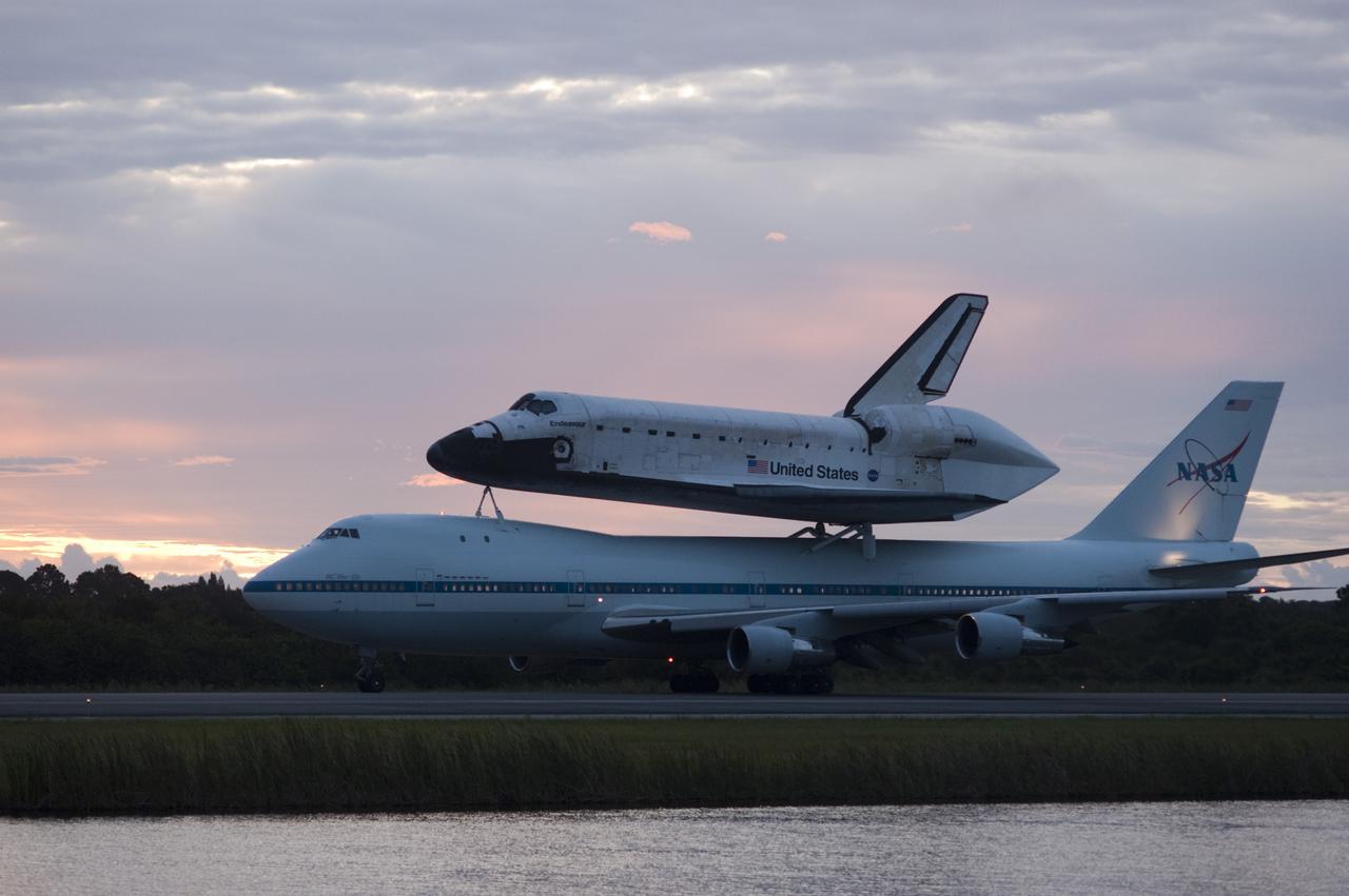 CAPE CANAVERAL, Fla. – Space shuttle Endeavour, mounted atop NASA's Shuttle Carrier Aircraft or SCA, taxis at the Shuttle Landing Facility at NASA's Kennedy Space Center in Florida. The SCA, a modified 747 jetliner, will fly Endeavour to Los Angeles where it will be placed on public display at the California Science Center. This is the final ferry flight scheduled in the Space Shuttle Program era. For more information on the shuttles' transition and retirement, visit http://www.nasa.gov/transition. Photo credit: NASA/Rick Wetherington