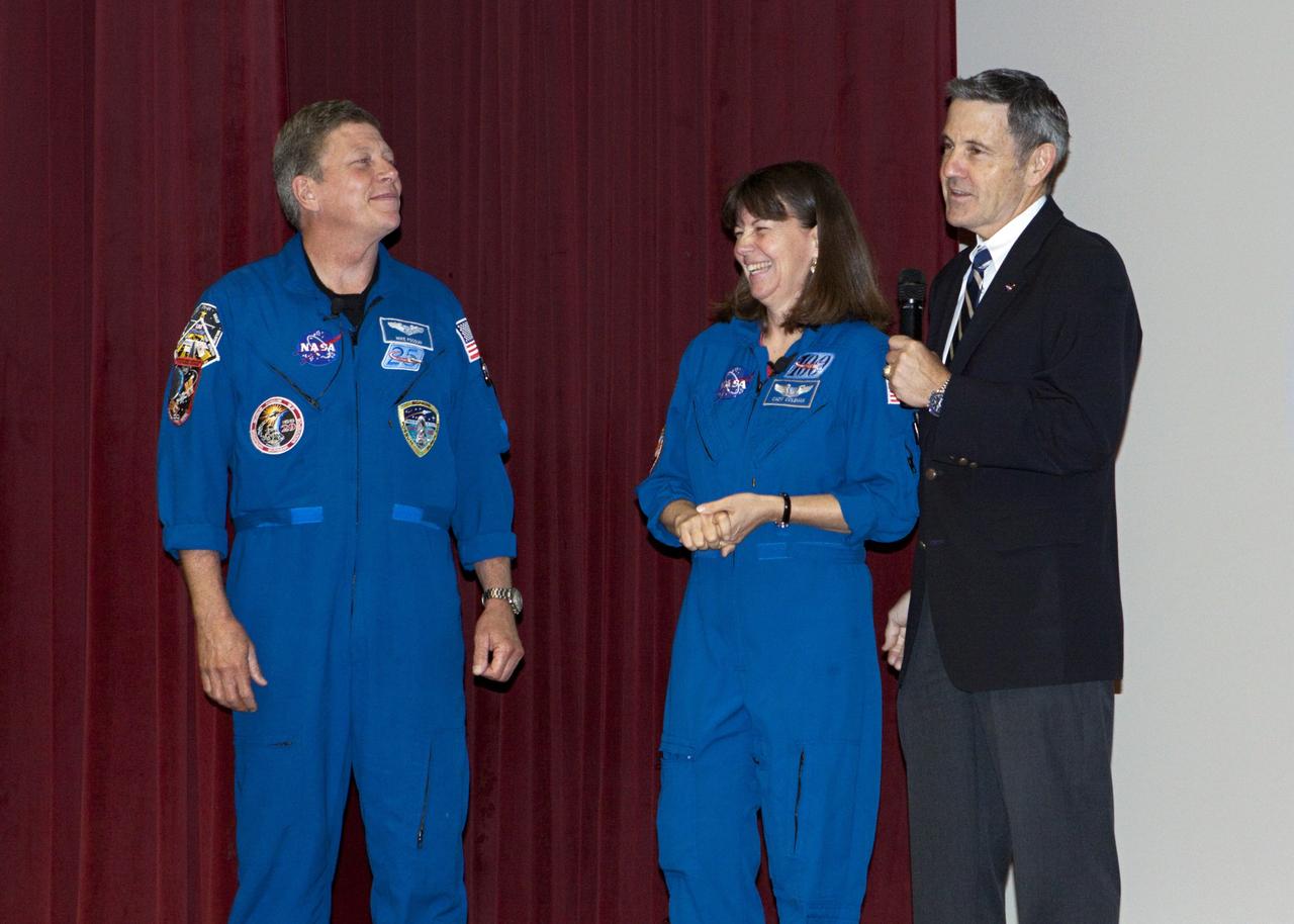 CAPE CANAVERAL, Fla. – Bob Cabana, director of NASA's Kennedy Space Center in Florida and a former space shuttle commander, right, introduces NASA astronauts Mike Fossum and Catherine Coleman to speak to Kennedy employees about their experiences aboard the International Space Station.      Coleman spent 159 days aboard the station during expeditions 26 and 27. During expeditions 28 and 29, Fossum was in space for 167 days. For more information on the space station, visit http://www.nasa.gov/mission_pages/station/expeditions/index.html  Photo credit: NASA/Gianni Woods