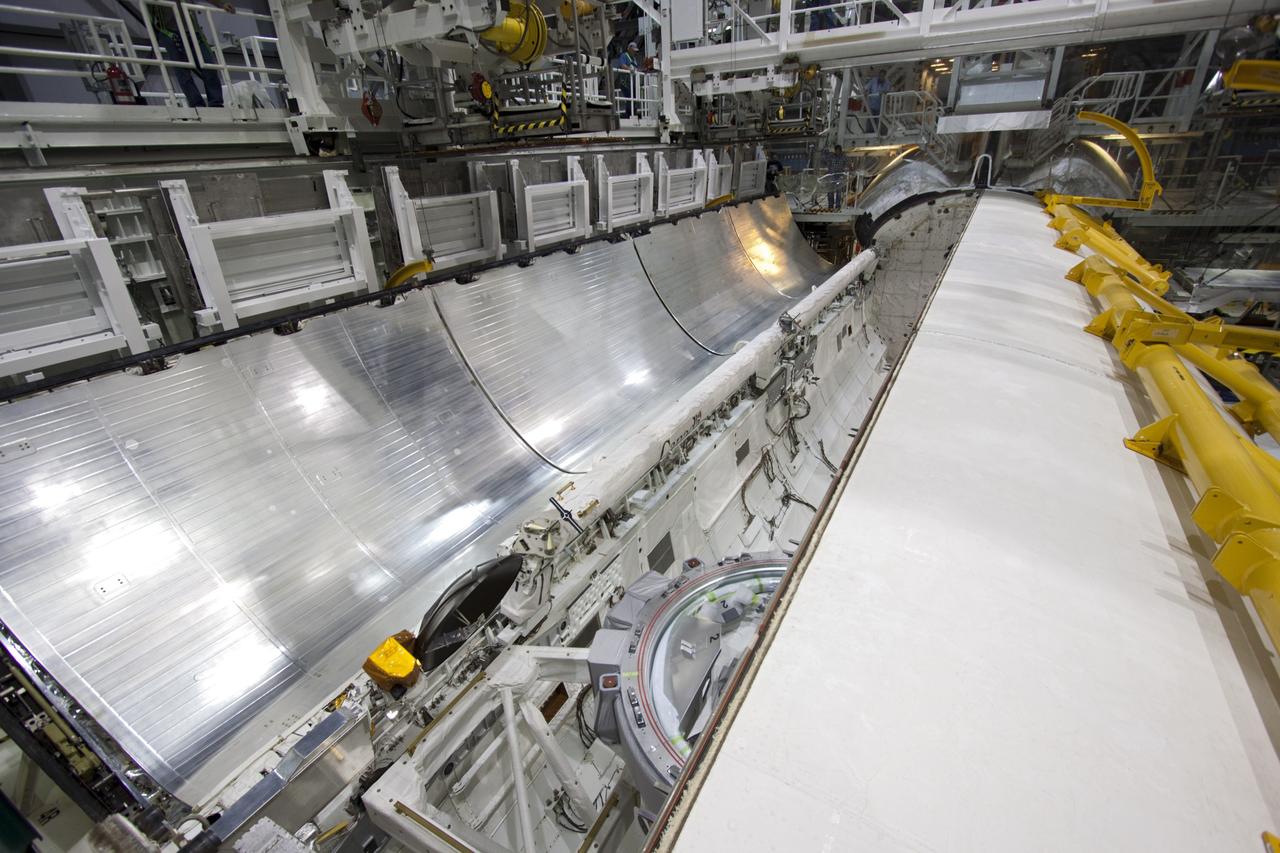 CAPE CANAVERAL, Fla. – Inside Orbiter Processing Facility-2 at NASA’s Kennedy Space Center in Florida, technicians begin to close Atlantis’ right payload bay door. Both payload bay doors will be closed for the final time.    The orbiter is undergoing final preparations for its transfer to the Kennedy Space Center Visitor complex targeted for November. The work is part of Transition and Retirement of the remaining shuttle. Atlantis is being prepared for public display at the visitor complex. Over the course of its 26-year career, Atlantis spent 293 days in space during 33 missions. For more information, visit http://www.nasa.gov/transition. Photo credit: NASA/Jim Grossmann