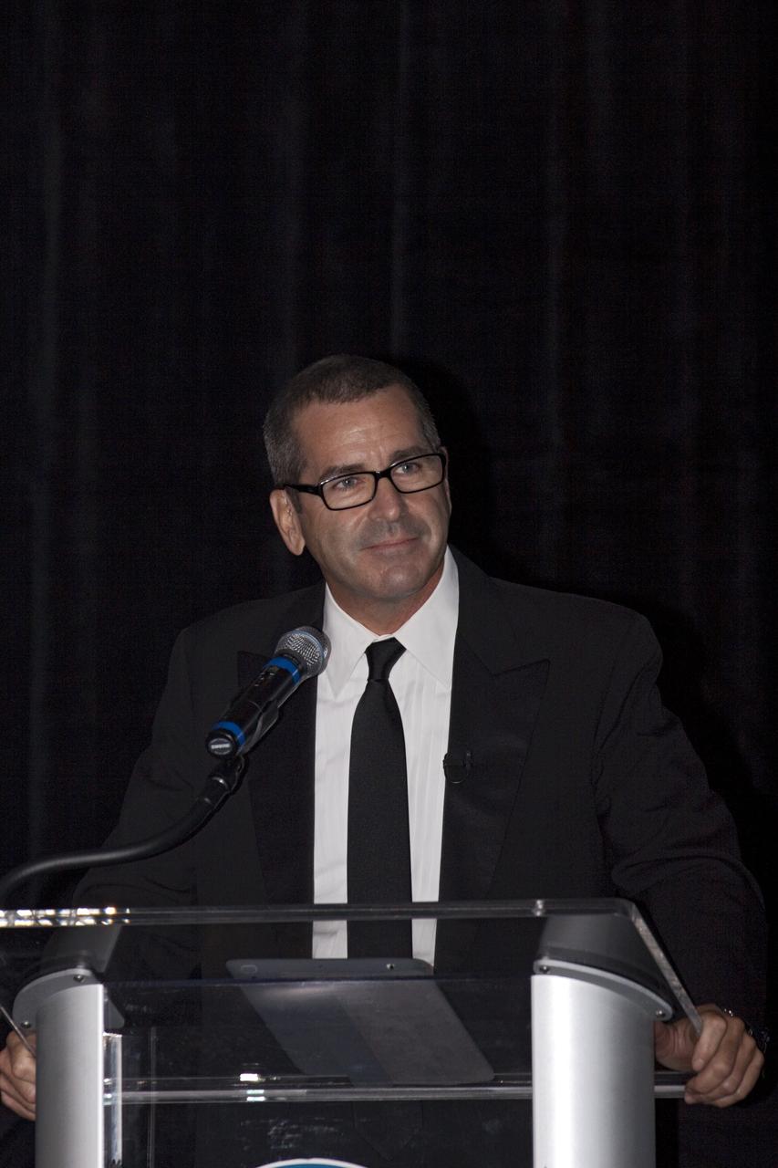 CAPE CANAVERAL, Fla. – PBS NewsHour Science Correspondent Miles O’Brien, speaks to attendees during Kennedy Space Center’s 50th Anniversary Gala event at the Kennedy Space Center Visitor Complex Apollo/Saturn V Center in Florida. The gala was coordinated by Kennedy and the National Space Club Florida Committee with the theme, “Celebrating the Past and Preparing for the Future.” The event was attended by about 650 current and retired NASA and contractor workers, dignitaries, and several former Kennedy Space Center directors. Photo credit: NASA/Kim Shiflett
