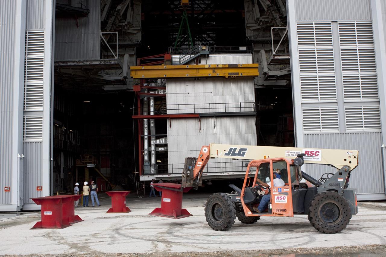 CAPE CANAVERAL, Fla. – As part of NASA's Ground Systems Development and Operations Program at the Kennedy Space Center in Florida, support pedestals are moved into position just outside the doors of the Vehicle Assembly Building, or VAB. Inside, a large work platform is being removed from an upper level to the ground. The effort is part of modernization plans including flexible settings for multiple launch vehicles instead of the whole building supporting one design. The Ground Systems Development and Operations Program is developing the necessary ground systems, infrastructure and operational approaches required to safely process, assemble, transport and launch the next generation of rockets and spacecraft in support of NASA’s exploration objectives. Future work also will replace the antiquated communications, power and vehicle access resources with modern efficient systems. Some of the utilities and systems slated for replacement have been used since the VAB opened in 1965. For more information, visit http://www.nasa.gov/exploration/systems/ground/index.html Photo credit: NASA/Jim Grossmann
