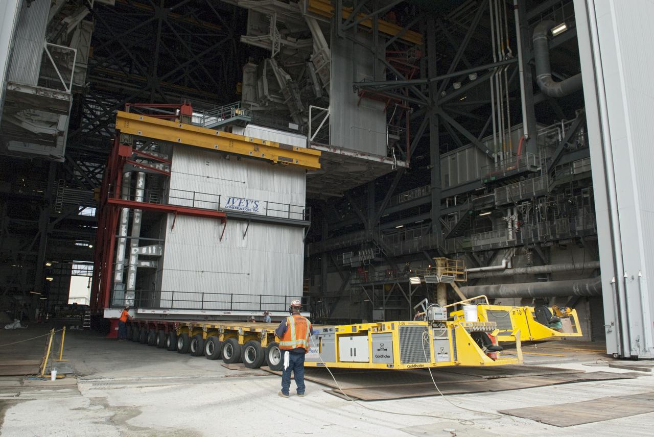 CAPE CANAVERAL, Fla. – As part of NASA's Ground Systems Development and Operations Program at the Kennedy Space Center in Florida, a work platform is lowered onto a transporter for removal from the Vehicle Assembly Building, or VAB. As part of a modernization effort, flexible settings area being designed for multiple launch vehicles instead of the whole building supporting one design. The Ground Systems Development and Operations Program is developing the necessary ground systems, infrastructure and operational approaches required to safely process, assemble, transport and launch the next generation of rockets and spacecraft in support of NASA’s exploration objectives. Future work also will replace the antiquated communications, power and vehicle access resources with modern efficient systems. Some of the utilities and systems slated for replacement have been used since the VAB opened in 1965. For more information, visit http://www.nasa.gov/exploration/systems/ground/index.html Photo credit: NASA/Charisse Nahser