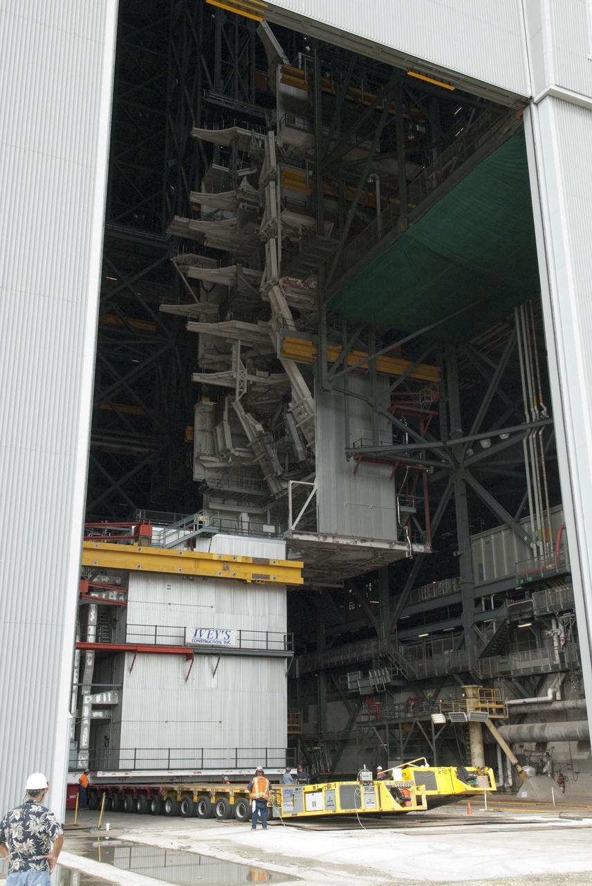 CAPE CANAVERAL, Fla. – As part of NASA's Ground Systems Development and Operations Program at the Kennedy Space Center in Florida, a work platform is lowered onto a transporter for removal from the Vehicle Assembly Building, or VAB. As part of a modernization effort, flexible settings area being designed for multiple launch vehicles instead of the whole building supporting one design. The Ground Systems Development and Operations Program is developing the necessary ground systems, infrastructure and operational approaches required to safely process, assemble, transport and launch the next generation of rockets and spacecraft in support of NASA’s exploration objectives. Future work also will replace the antiquated communications, power and vehicle access resources with modern efficient systems. Some of the utilities and systems slated for replacement have been used since the VAB opened in 1965. For more information, visit http://www.nasa.gov/exploration/systems/ground/index.html Photo credit: NASA/Charisse Nahser