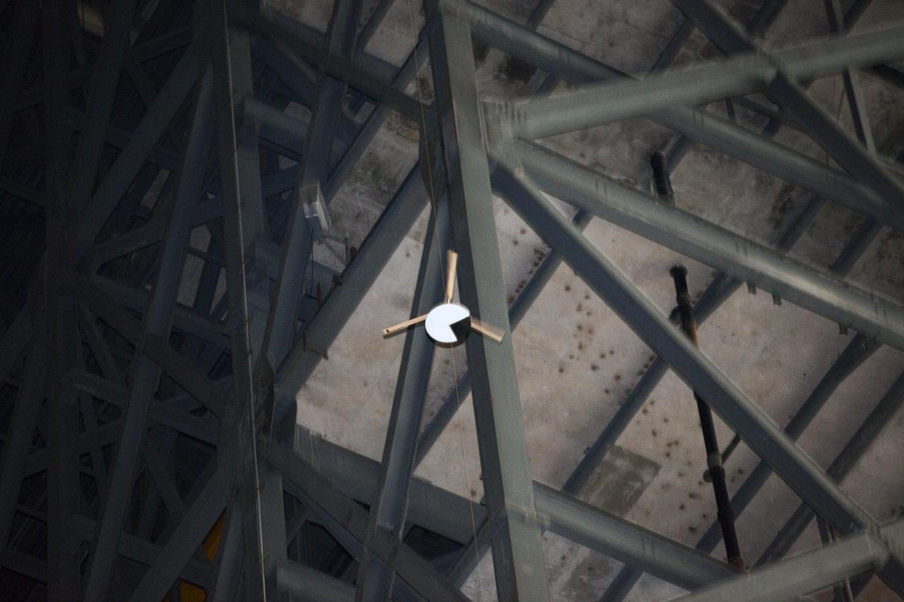 CAPE CANAVERAL, Fla. - A model capsule seen ahead of tests inside the Vehicle Assembly Building at NASA's Kennedy Space Center in Florida to test a rotor system landing design. The design would give a capsule the stability and control of a helicopter, but would not be powered. Instead, the wind passing over the rotors as the capsule descends would make the blades turn, a process called auto-rotation. The intent is to give real spacecraft a soft landing with enough control that they could touch down anywhere in the world, whether it be a runway or parking lot. In other words, wherever a helicopter could land, a spacecraft could land, too. Photo credit: NASA/Kim Shiflett