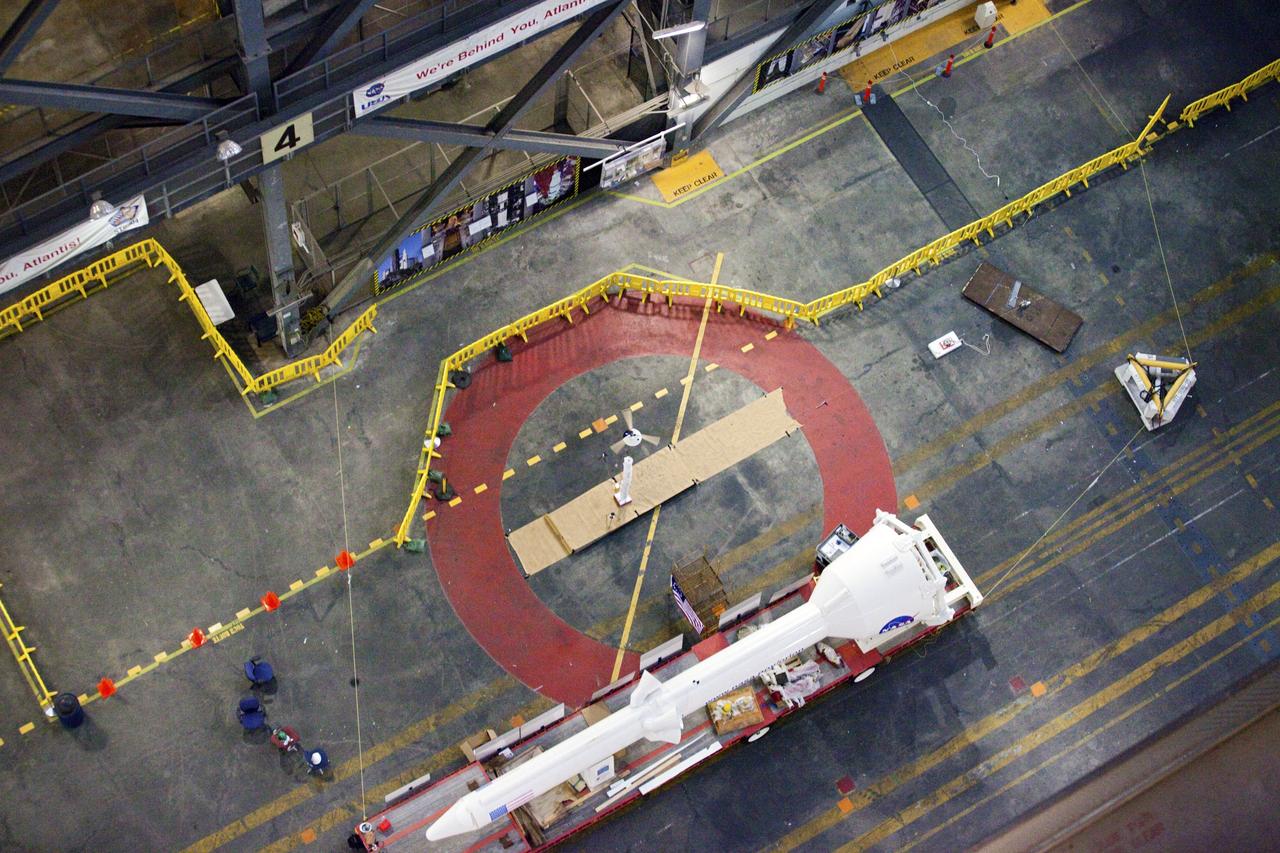 CAPE CANAVERAL, Fla. - A model capsule falls during tests inside the Vehicle Assembly Building at NASA's Kennedy Space Center in Florida to test a rotor system landing design. The design would give a capsule the stability and control of a helicopter, but would not be powered. Instead, the wind passing over the rotors as the capsule descends would make the blades turn, a process called auto-rotation. The intent is to give real spacecraft a soft landing with enough control that they could touch down anywhere in the world, whether it be a runway or parking lot. In other words, wherever a helicopter could land, a spacecraft could land, too. Photo credit: NASA/Kim Shiflett