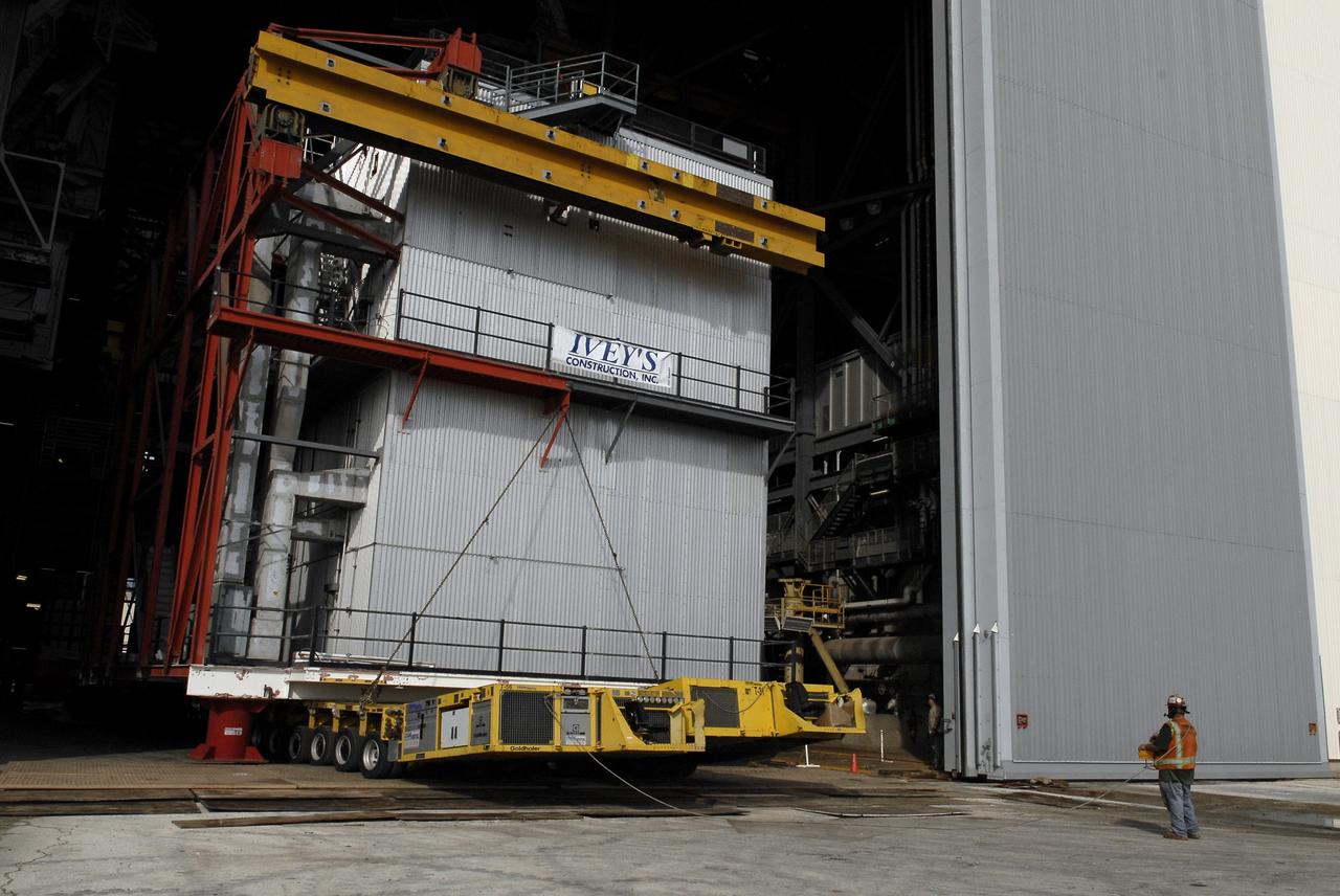 CAPE CANAVERAL, Fla. – At NASA’s Kennedy Space Center in Florida, construction workers remove a large space shuttle-era work platform from high bay 3 inside the Vehicle Assembly Building, or VAB. The platform will be moved to the VAB north parking area for temporary storage.    The work is part of a centerwide refurbishment initiative under the Ground Systems Development and Operations, or GSDO, Program. High bay 3 is being refurbished to accommodate NASA’s Space Launch System and a variety of other spacecraft.  For more information, visit http://www.nasa.gov/exploration/systems/ground/index.html. Photo credit: NASA/Charisse Nahser