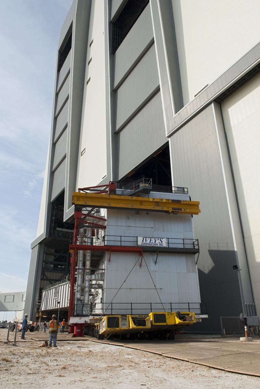 CAPE CANAVERAL, Fla. – At NASA’s Kennedy Space Center in Florida, construction workers have removed a space shuttle-era work platform from high bay 3 inside the Vehicle Assembly Building, or VAB. The platform will be moved to the VAB north parking area for temporary storage.    The work is part of a centerwide refurbishment initiative under the Ground Systems Development and Operations, or GSDO, Program. High bay 3 is being refurbished to accommodate NASA’s Space Launch System and a variety of other spacecraft.  For more information, visit http://www.nasa.gov/exploration/systems/ground/index.html. Photo credit: NASA/Charisse Nahser