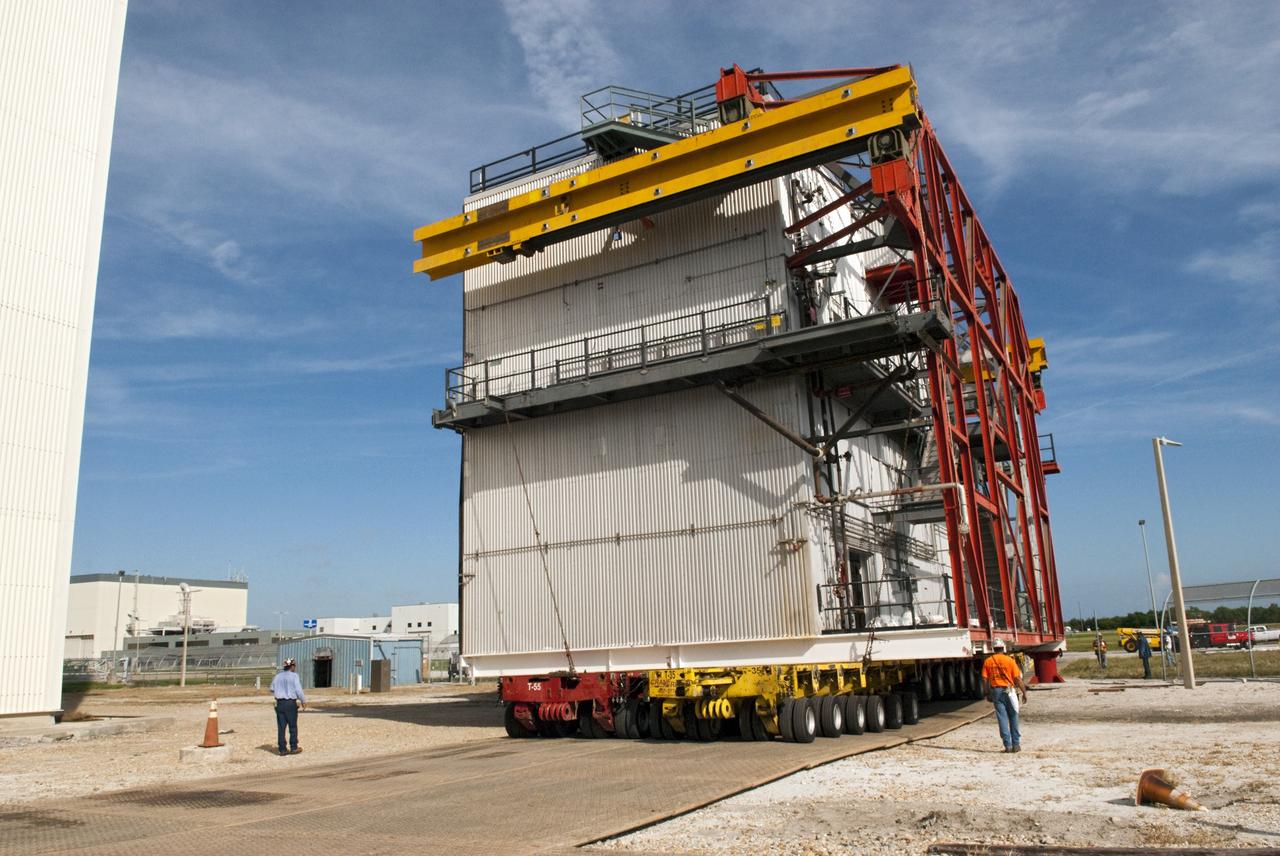 CAPE CANAVERAL, Fla. – At NASA’s Kennedy Space Center in Florida, construction workers have removed a space shuttle-era work platform from high bay 3 inside the Vehicle Assembly Building, or VAB. Using a large transporter, the platform will be moved to the VAB north parking area for temporary storage.    The work is part of a centerwide refurbishment initiative under the Ground Systems Development and Operations, or GSDO, Program. High bay 3 is being refurbished to accommodate NASA’s Space Launch System and a variety of other spacecraft.  For more information, visit http://www.nasa.gov/exploration/systems/ground/index.html. Photo credit: NASA/Charisse Nahser