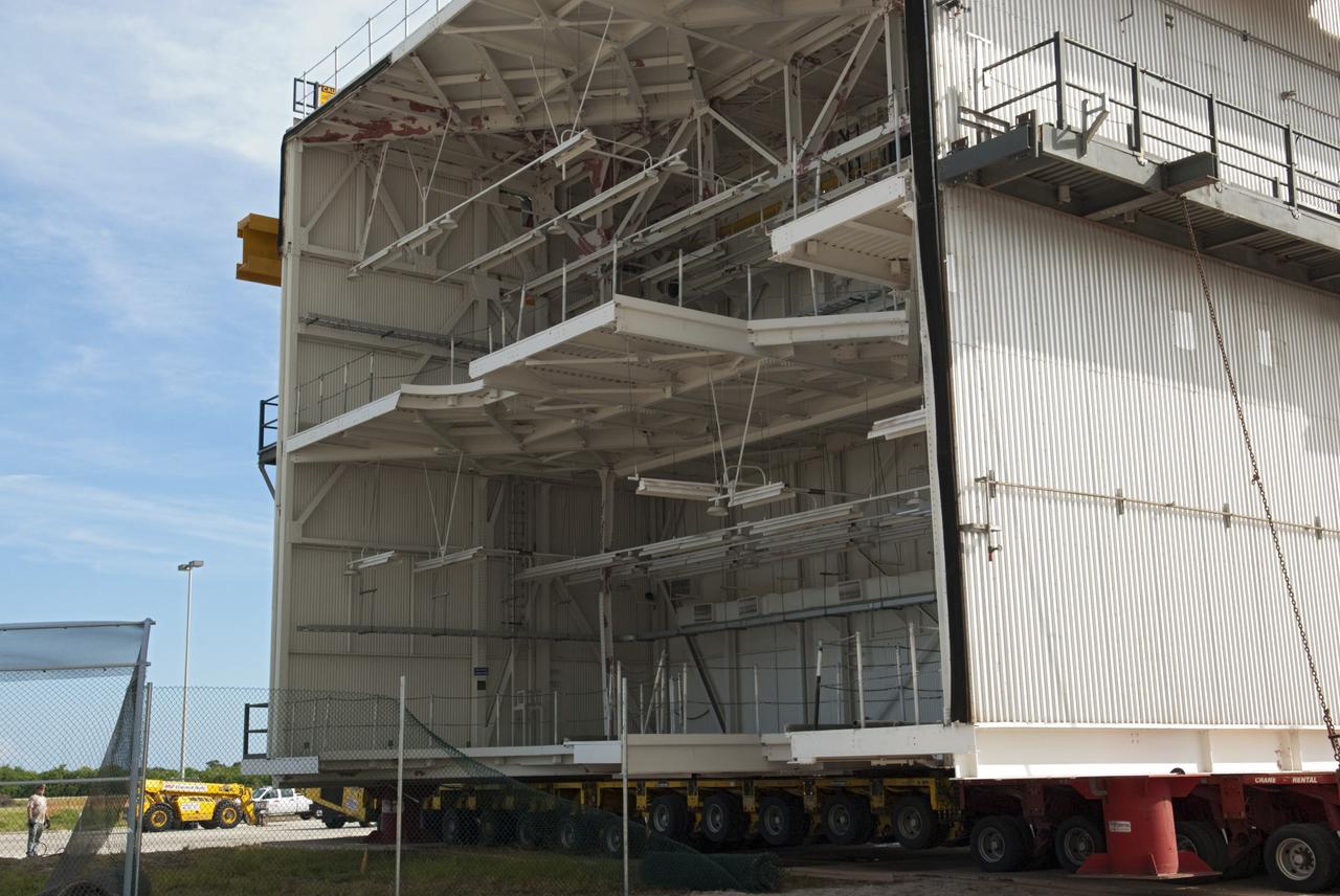 CAPE CANAVERAL, Fla. – At NASA’s Kennedy Space Center in Florida, construction workers have removed a space shuttle-era work platform from high bay 3 inside the Vehicle Assembly Building, or VAB. The platform has been moved to the VAB north parking area for temporary storage.    The work is part of a centerwide refurbishment initiative under the Ground Systems Development and Operations, or GSDO, Program. High bay 3 is being refurbished to accommodate NASA’s Space Launch System and a variety of other spacecraft.  For more information, visit http://www.nasa.gov/exploration/systems/ground/index.html. Photo credit: NASA/Charisse Nahser